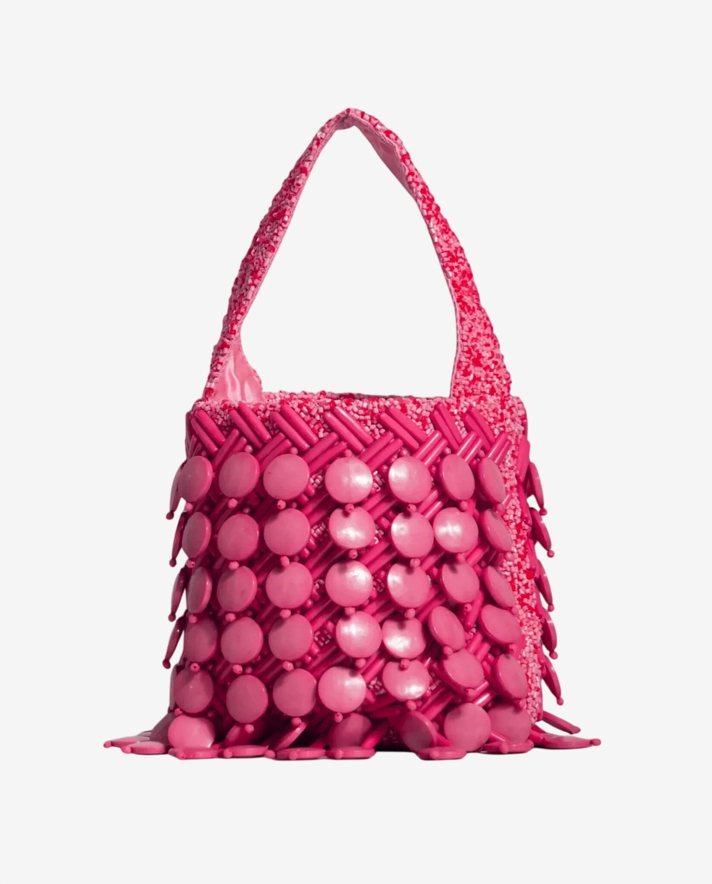 Borsa a mano rosa decorata con dischi circolari e perline intrecciate.