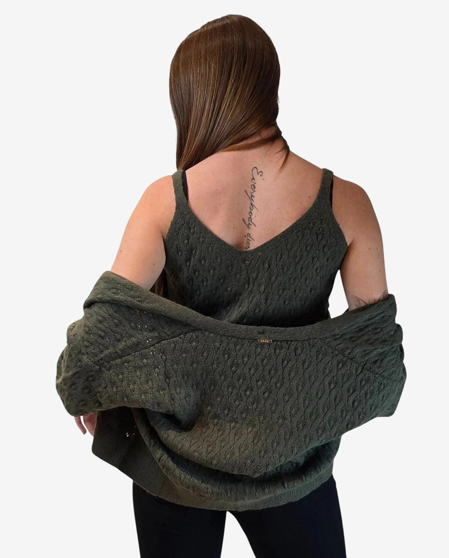 A woman wears a matching olive green textured knit tank top and cardigan set.