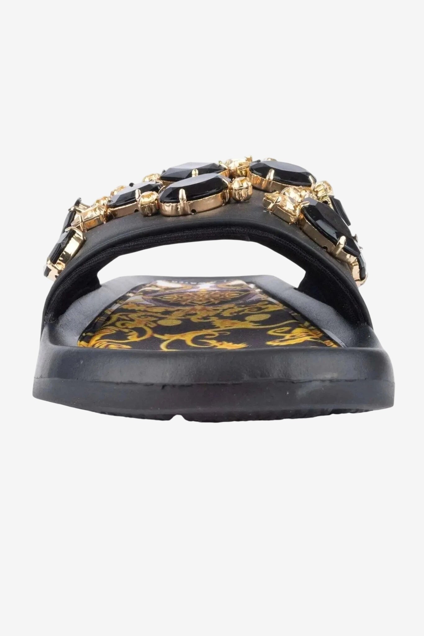 Ciabattina bassa nera decorata con pietre preziose e plantare interno a fantasia.