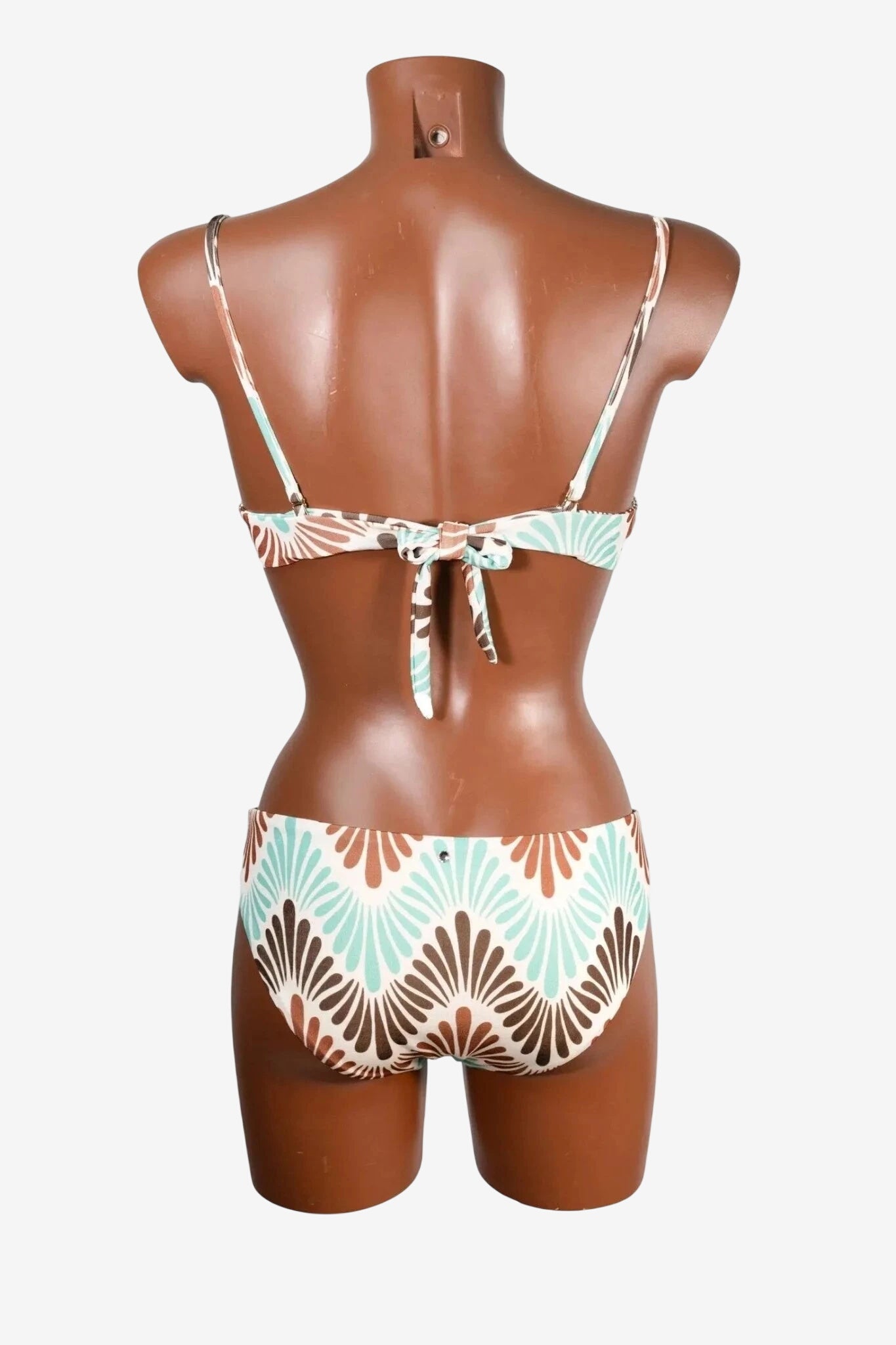 A back view of a bikini set featuring a brown and teal fan-shaped pattern on a white background.