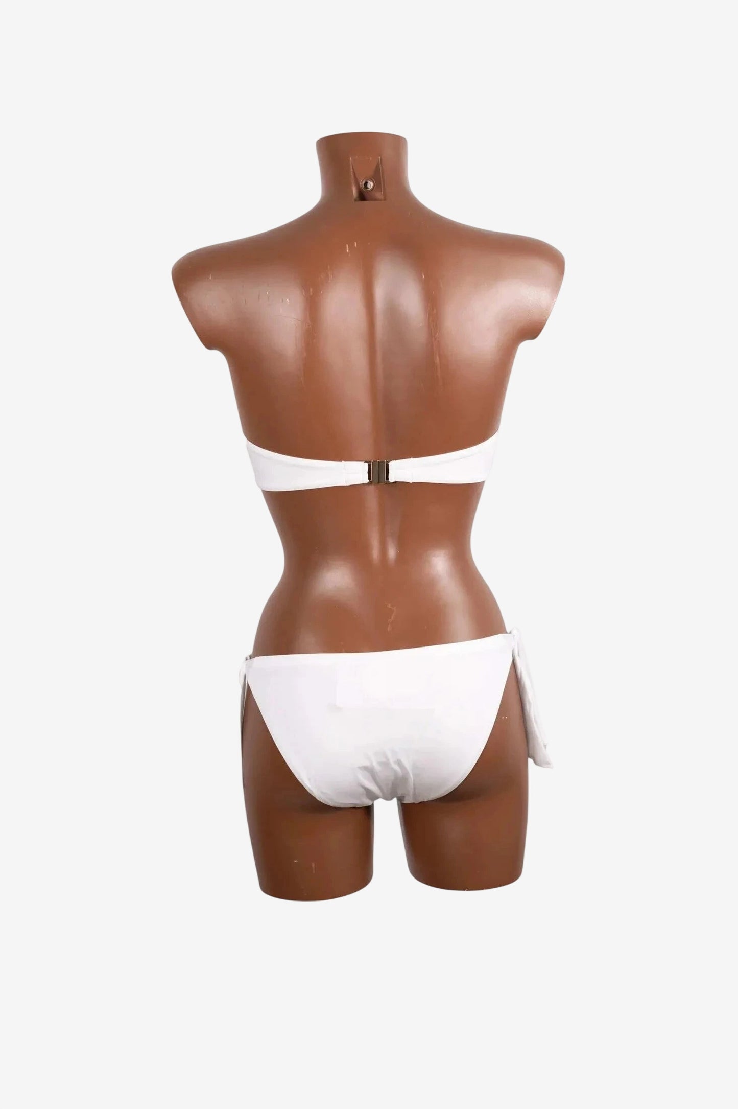 A white balconette bikini set shown from the back on a mannequin.
