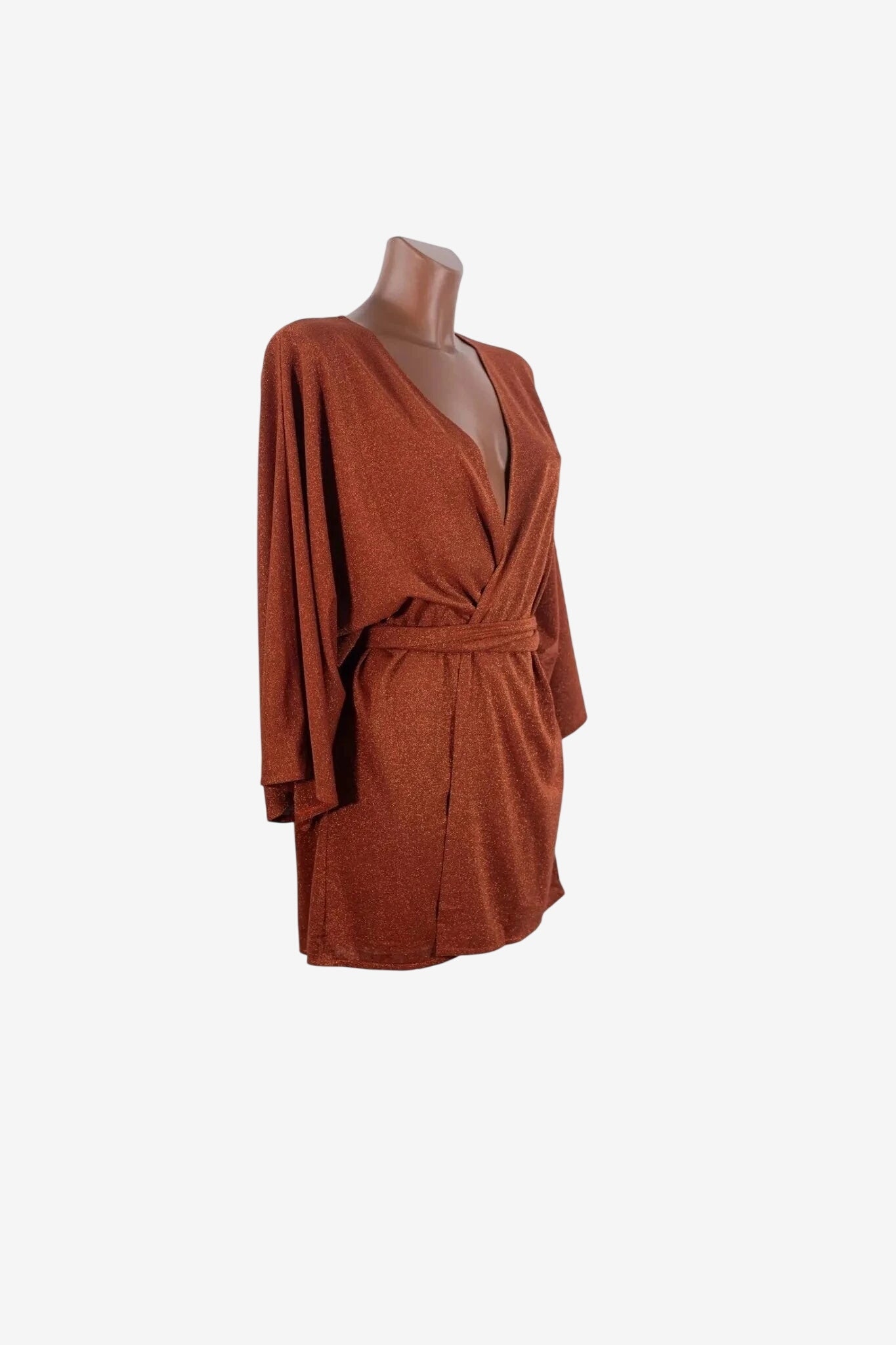 A copper-colored, shimmering kimono-style mini dress with a deep V-neck and a waist tie.