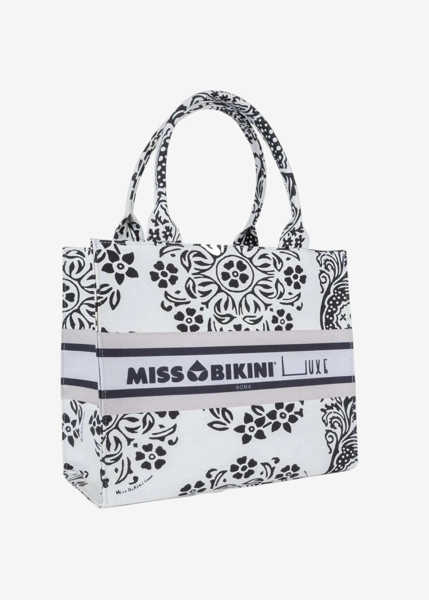 Borsa a mano Miss Bikini in canvas bianco con stampa floreale nera e logo centrale.