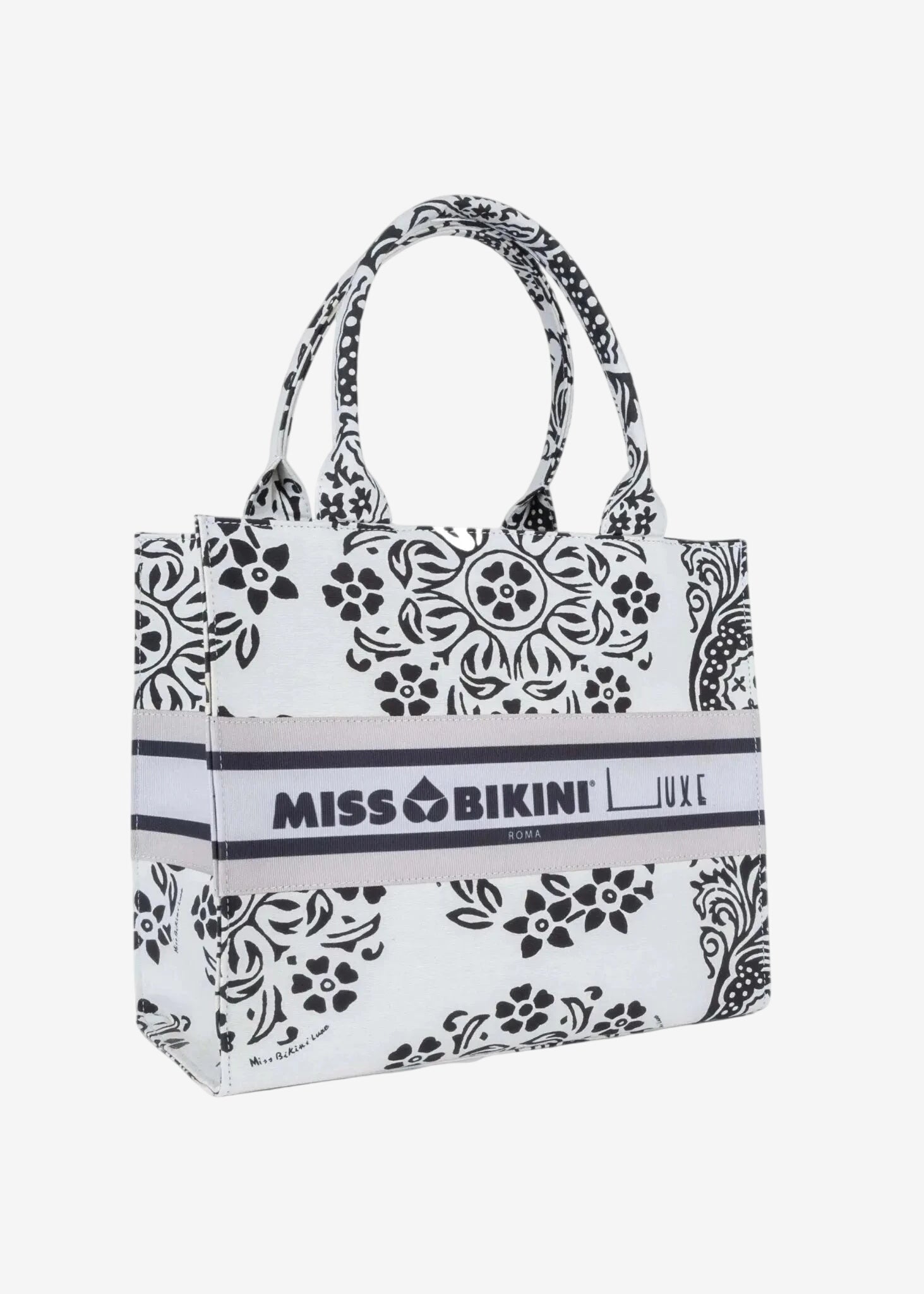 Borsa a mano Miss Bikini in canvas bianco con stampa floreale nera e logo centrale.
