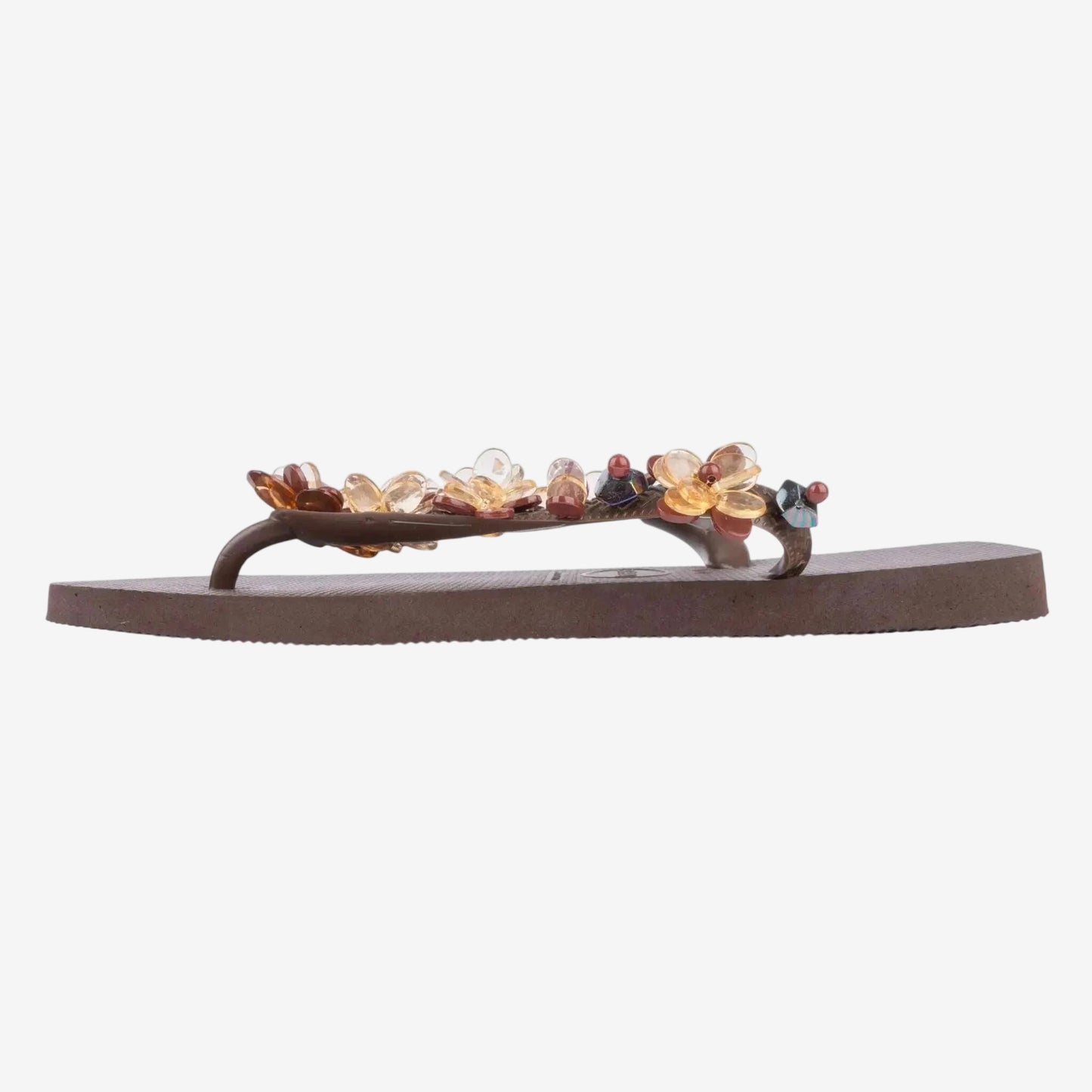 Infradito Havaianas marrone decorato con pietre preziose applicate sul cinturino.
