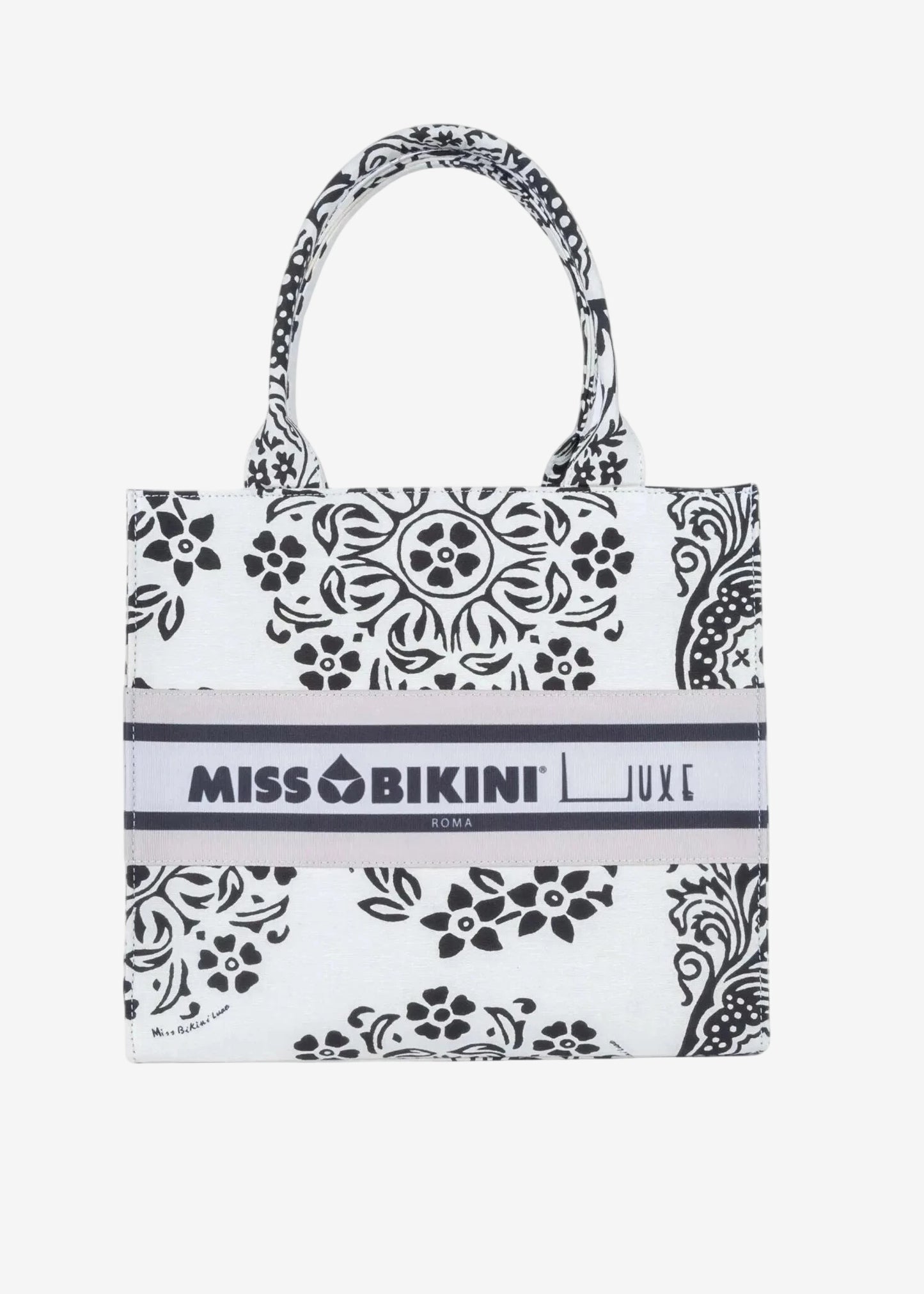 Borsa a mano in canvas bianco e nero con stampa floreale e logo Miss Bikini centrale.