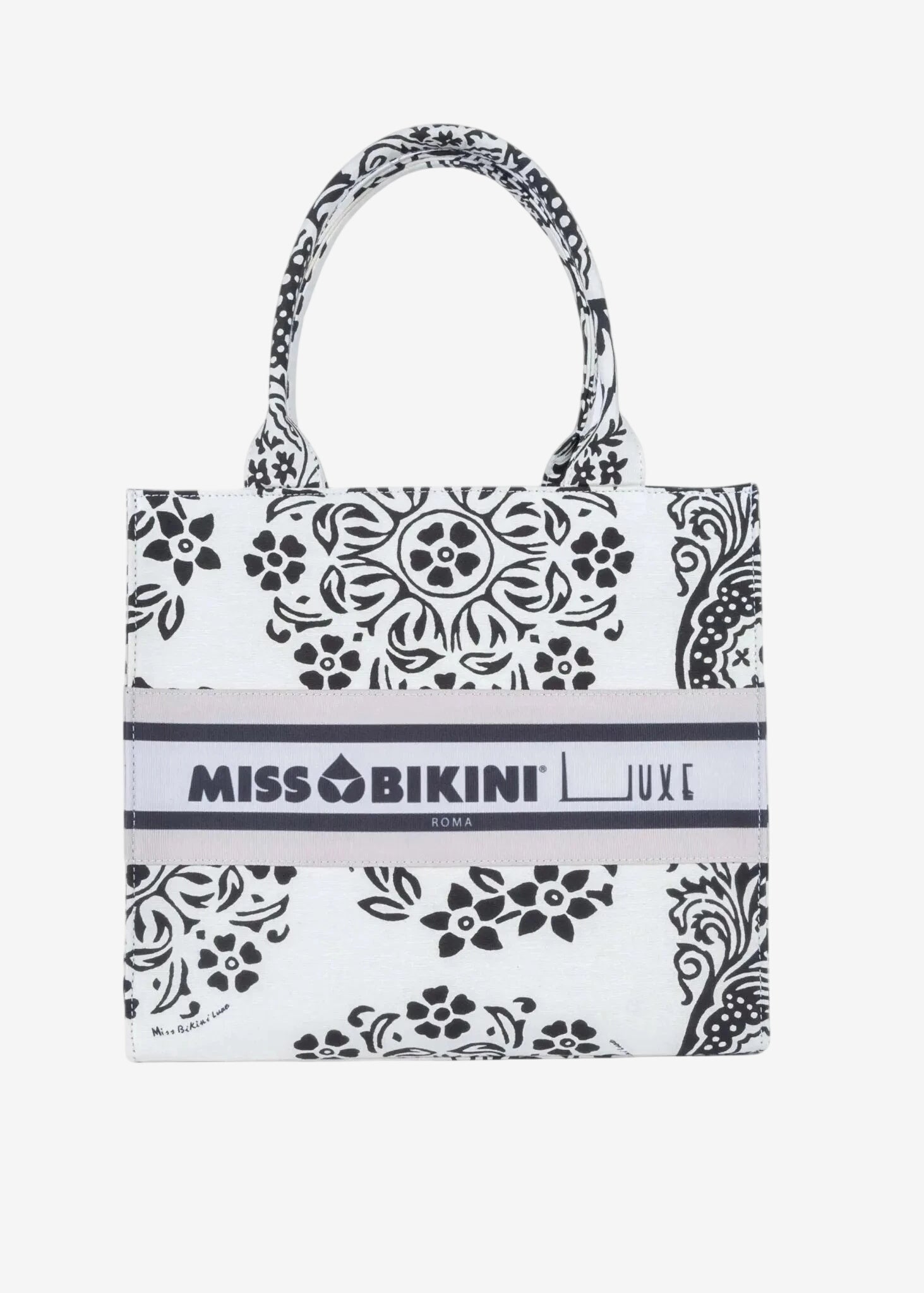Borsa a mano in canvas bianco e nero con stampa floreale e logo Miss Bikini centrale.