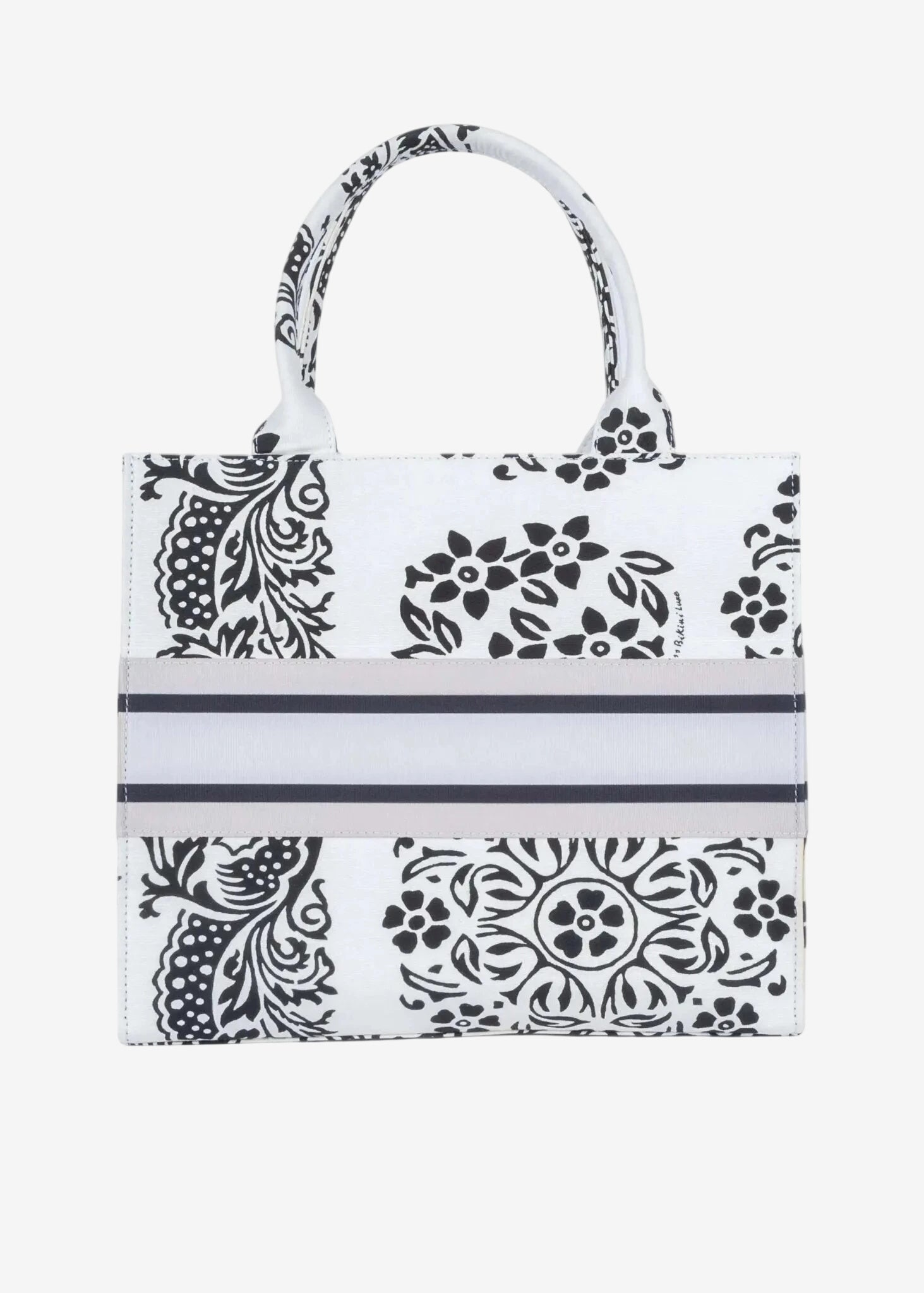 Borsa a mano Miss Bikini in canvas bianco con stampa floreale nera e fascia centrale a righe.