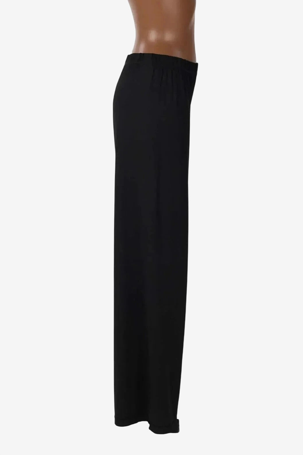 A pair of black wide-leg trousers with an elasticated waistband shown on a mannequin.