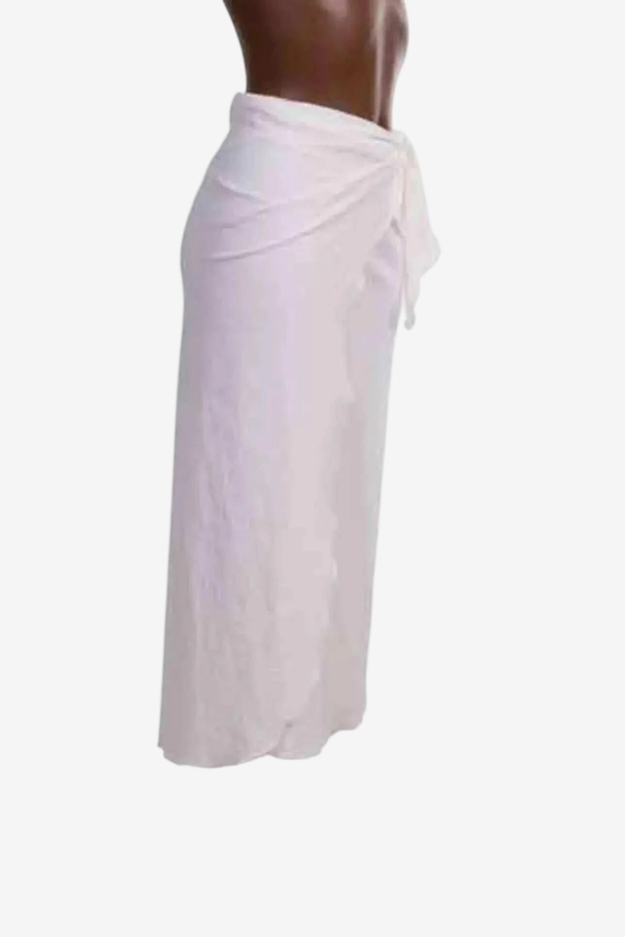 A white midi-length pareo skirt made from textured fabric with a side tie closure.