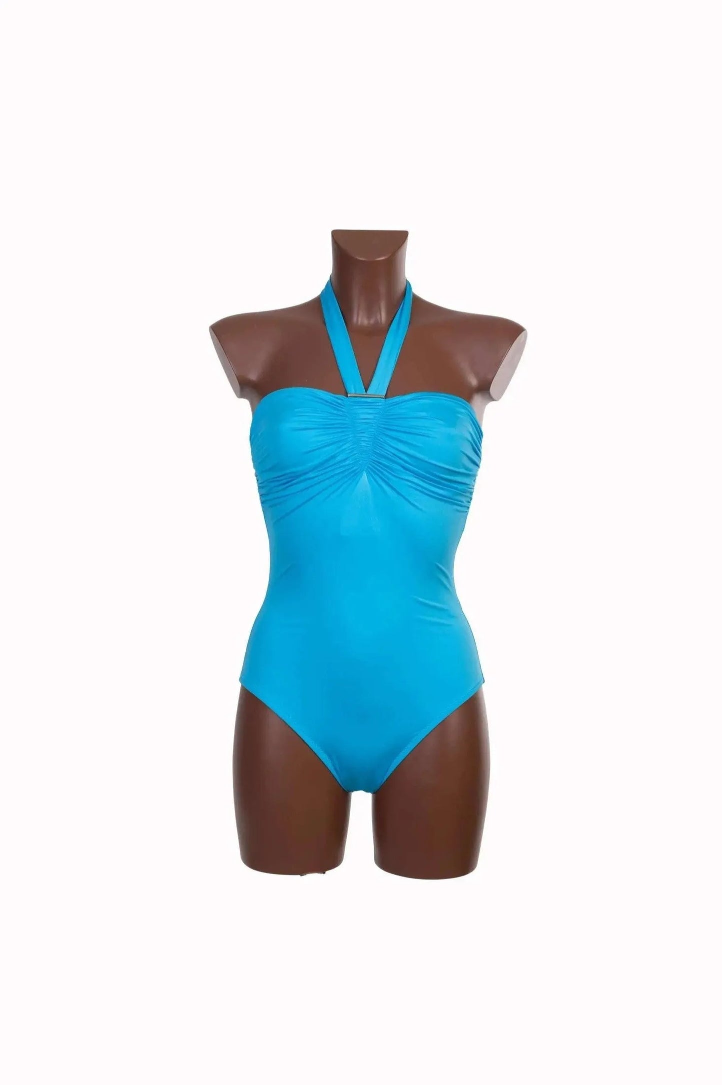 A bright blue one-piece swimsuit with a ruched bodice and a halter neckline on a mannequin.