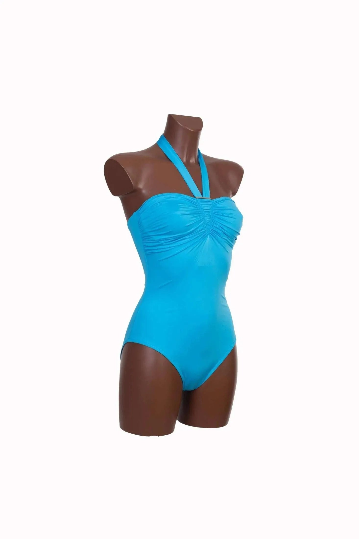 A bright blue one-piece swimsuit with a ruched bodice and halter neck on a mannequin.