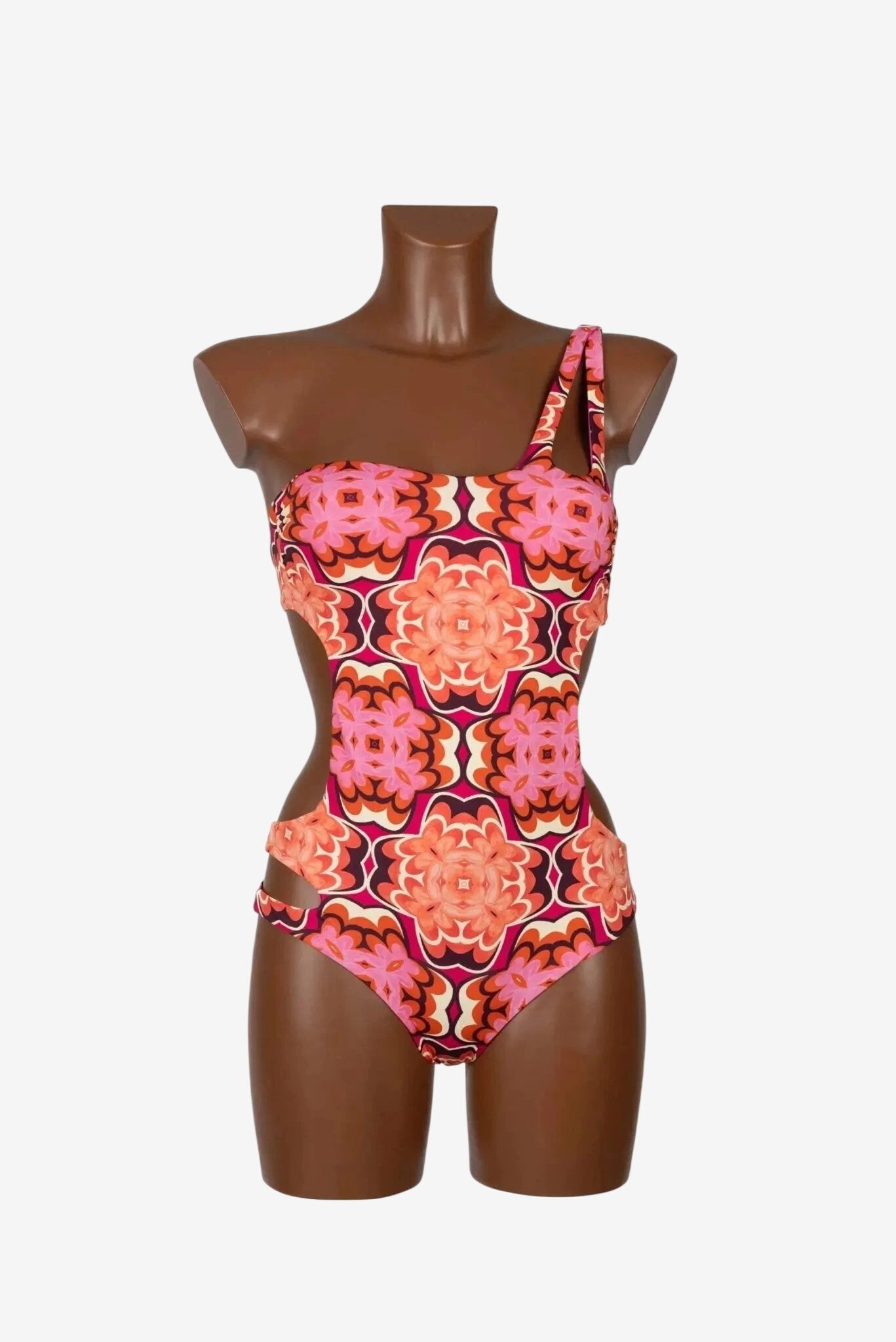 Costume intero trikini monospalla Miss Bikini con stampa geometrica nei toni del corallo.
