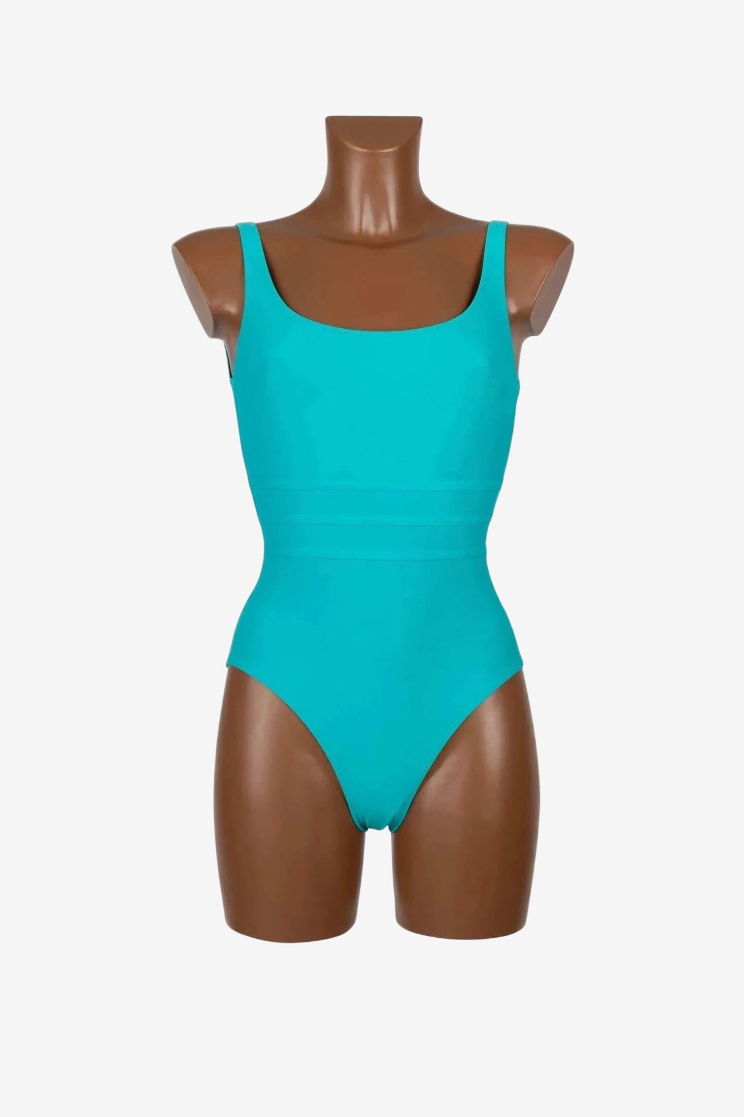 Costume intero olimpionico Roidal di colore verde acqua su manichino.