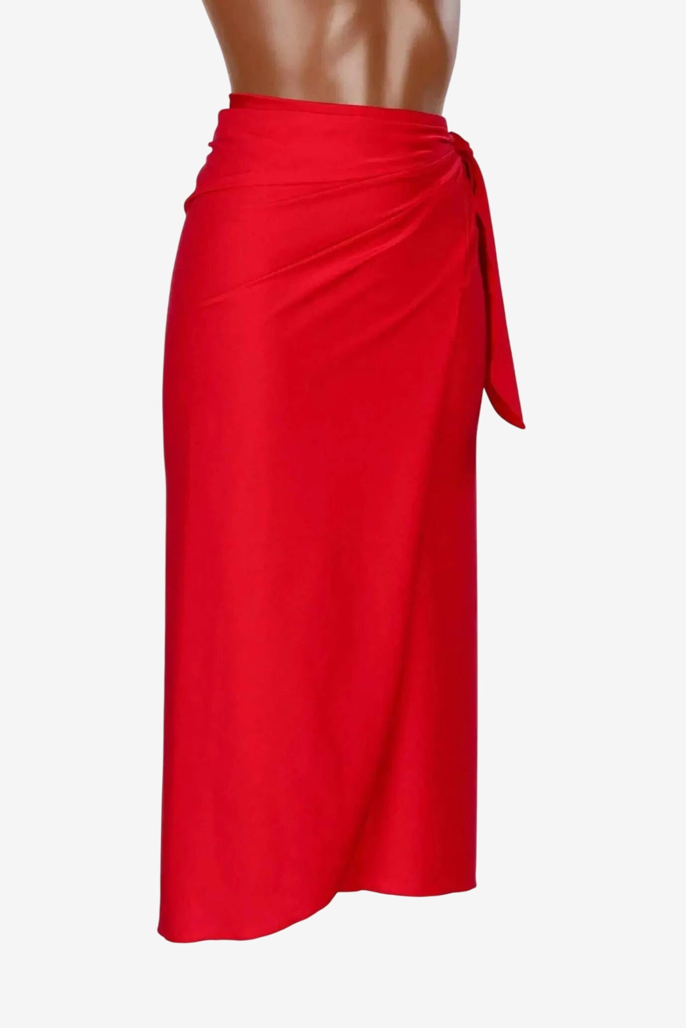 A midi-length red sarong skirt made from shiny lycra with a side tie closure.