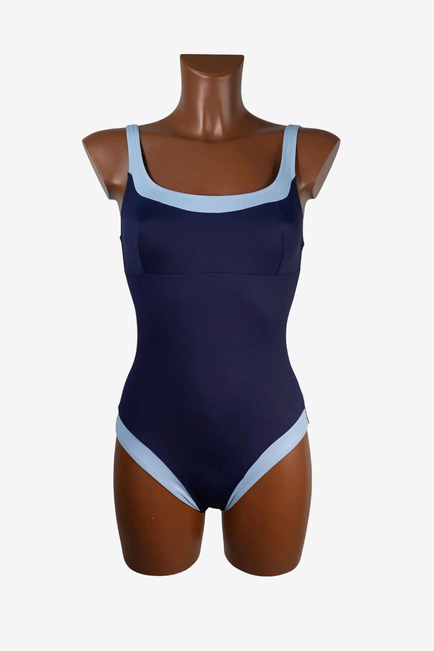 A navy blue one-piece swimsuit with light blue trim on the neckline and leg openings.