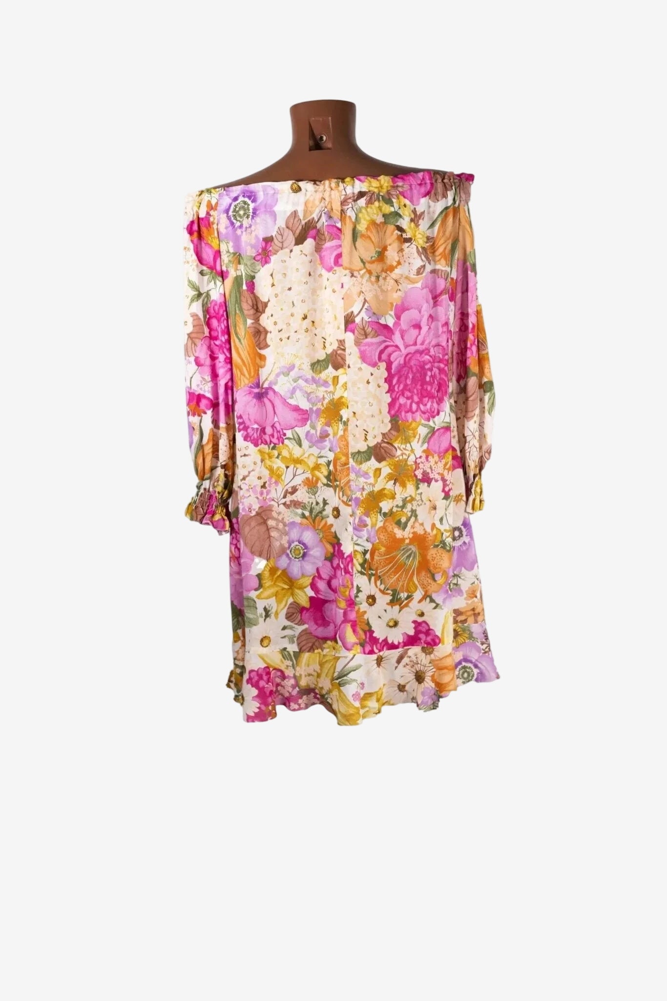 Caftano corto Raffaela D'Angelo con scollo a barca e fantasia floreale multicolore.