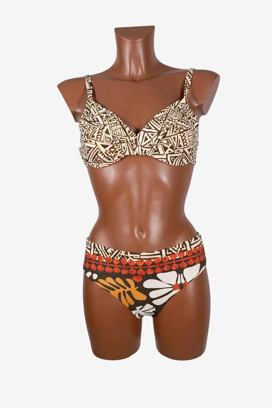 A two-piece bikini with a geometric print top and a floral patterned bottom on a mannequin.