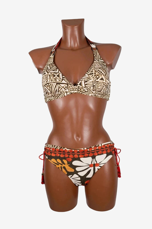 A two-piece bikini featuring a geometric print top and a floral print bottom with side ties.