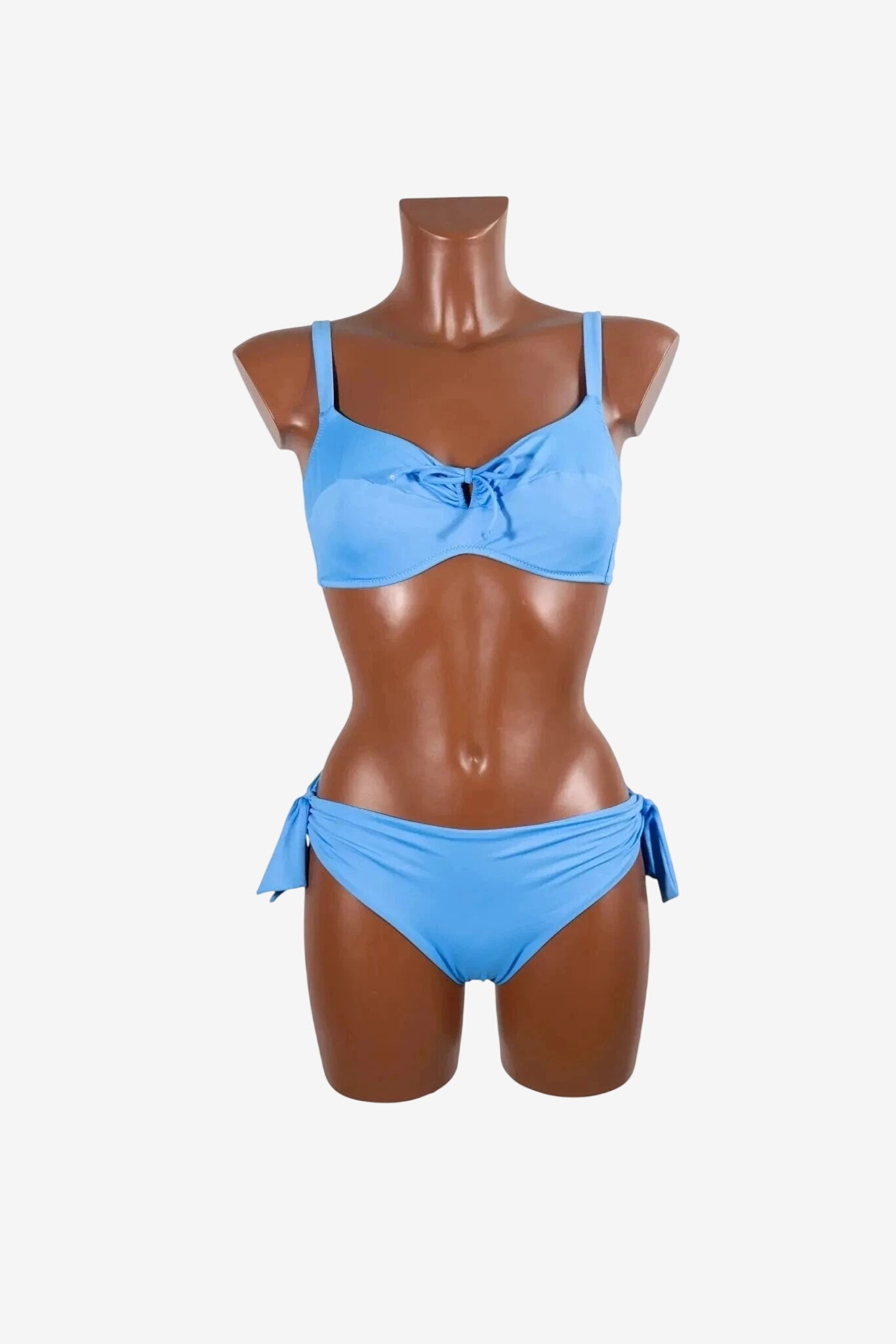 A light blue bikini set with a knotted top and tie-side bottoms displayed on a mannequin.