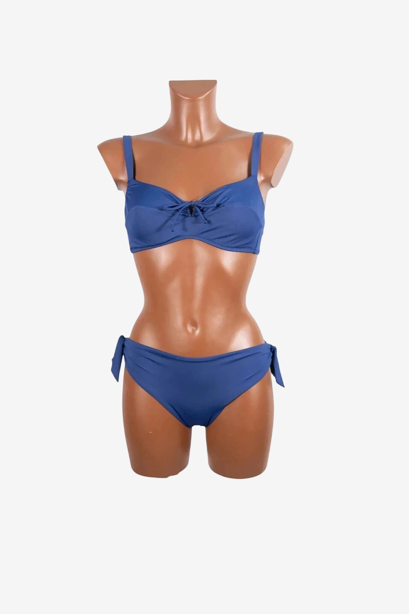 A blue two-piece bikini set with a tie-front top and side-tie bottoms on a mannequin.