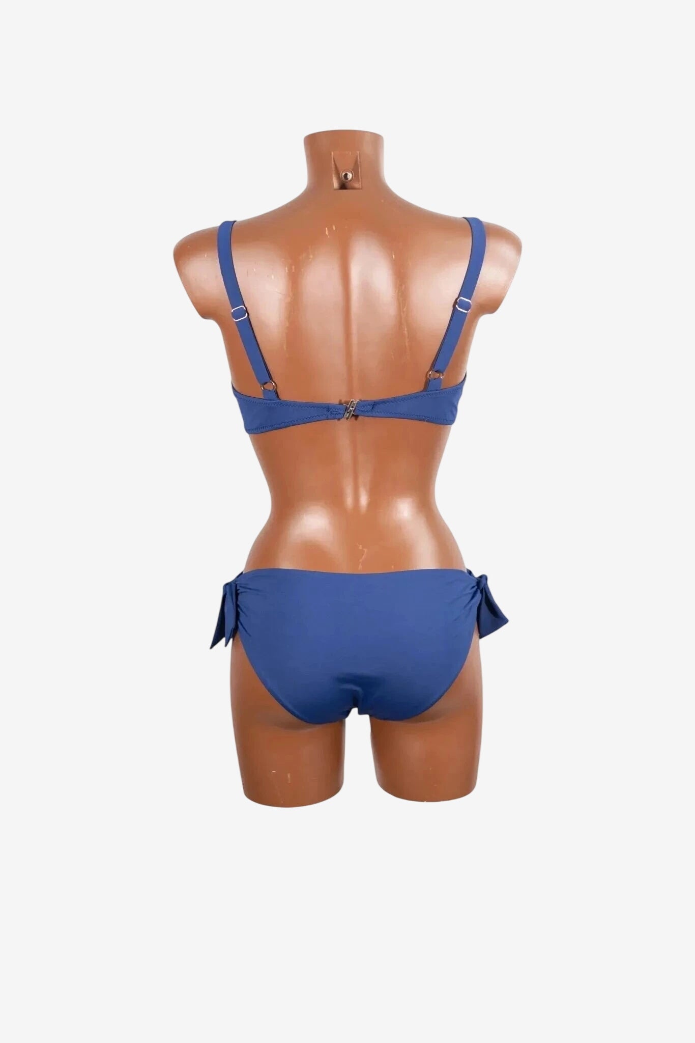 A blue bikini set shown from the back on a mannequin.