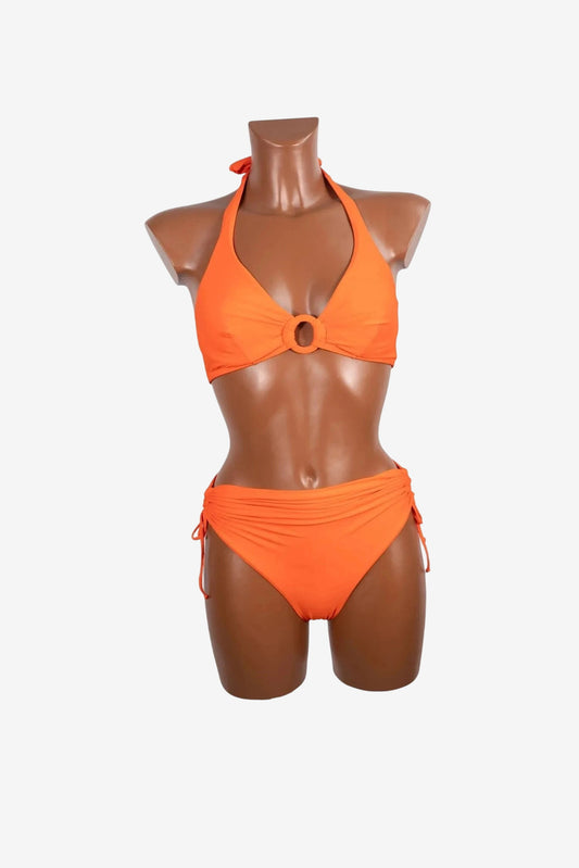 An orange bikini set featuring a halter top with a center ring and matching side-tie bottoms.