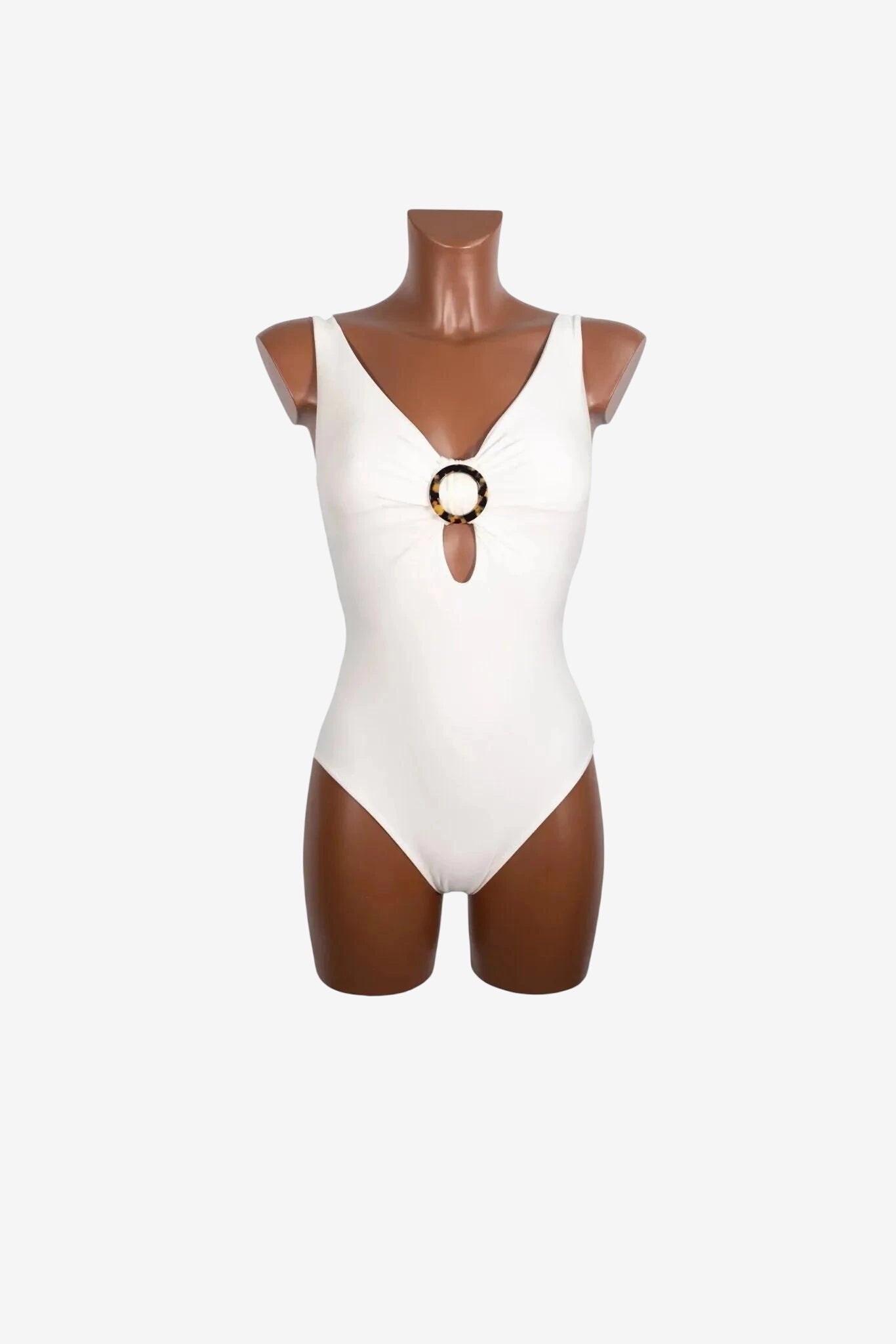 A white one-piece swimsuit featuring a V-neckline and a tortoiseshell ring detail at the center.