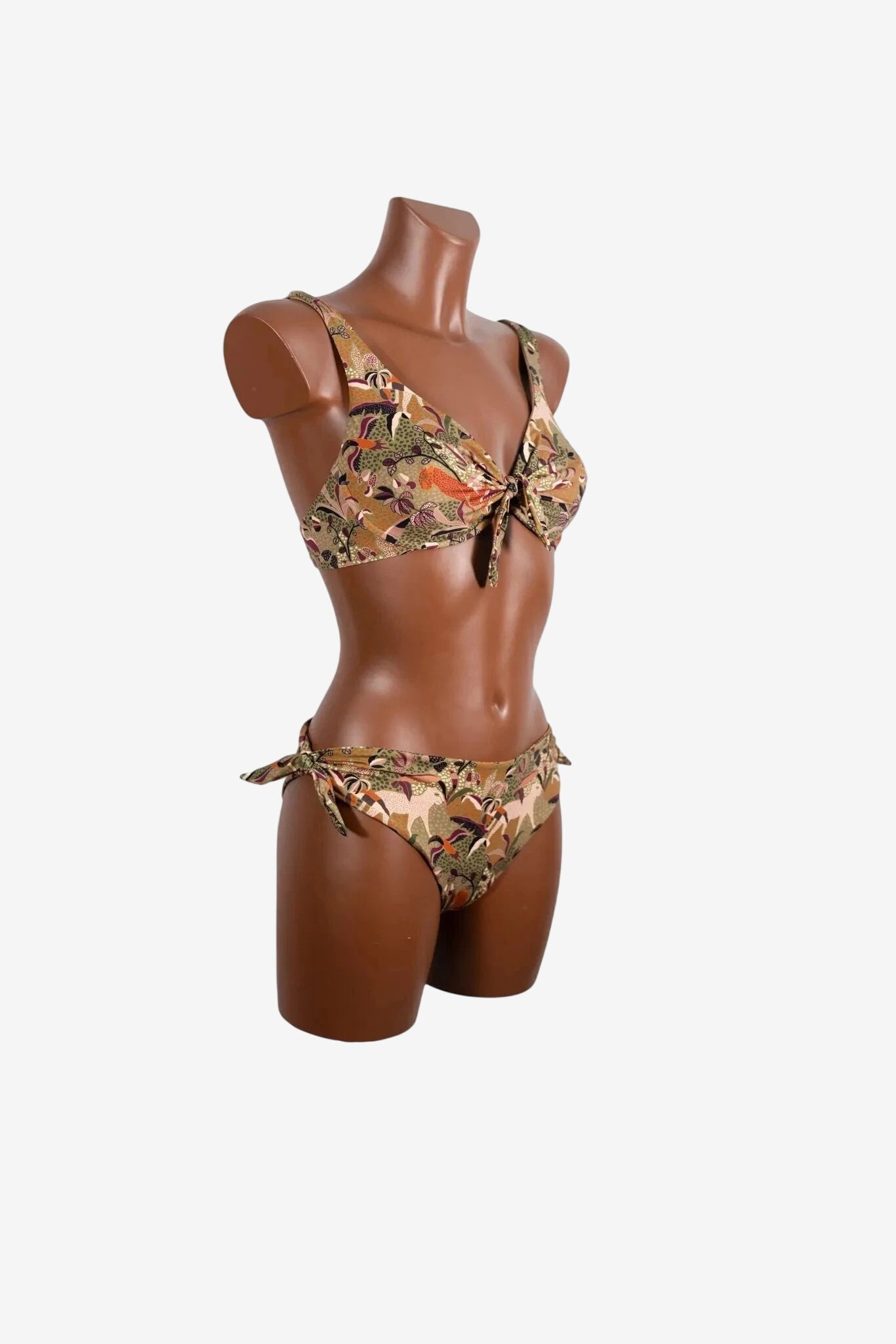 A brown patterned bikini with a tie-front top and side-tie bottoms on a mannequin.