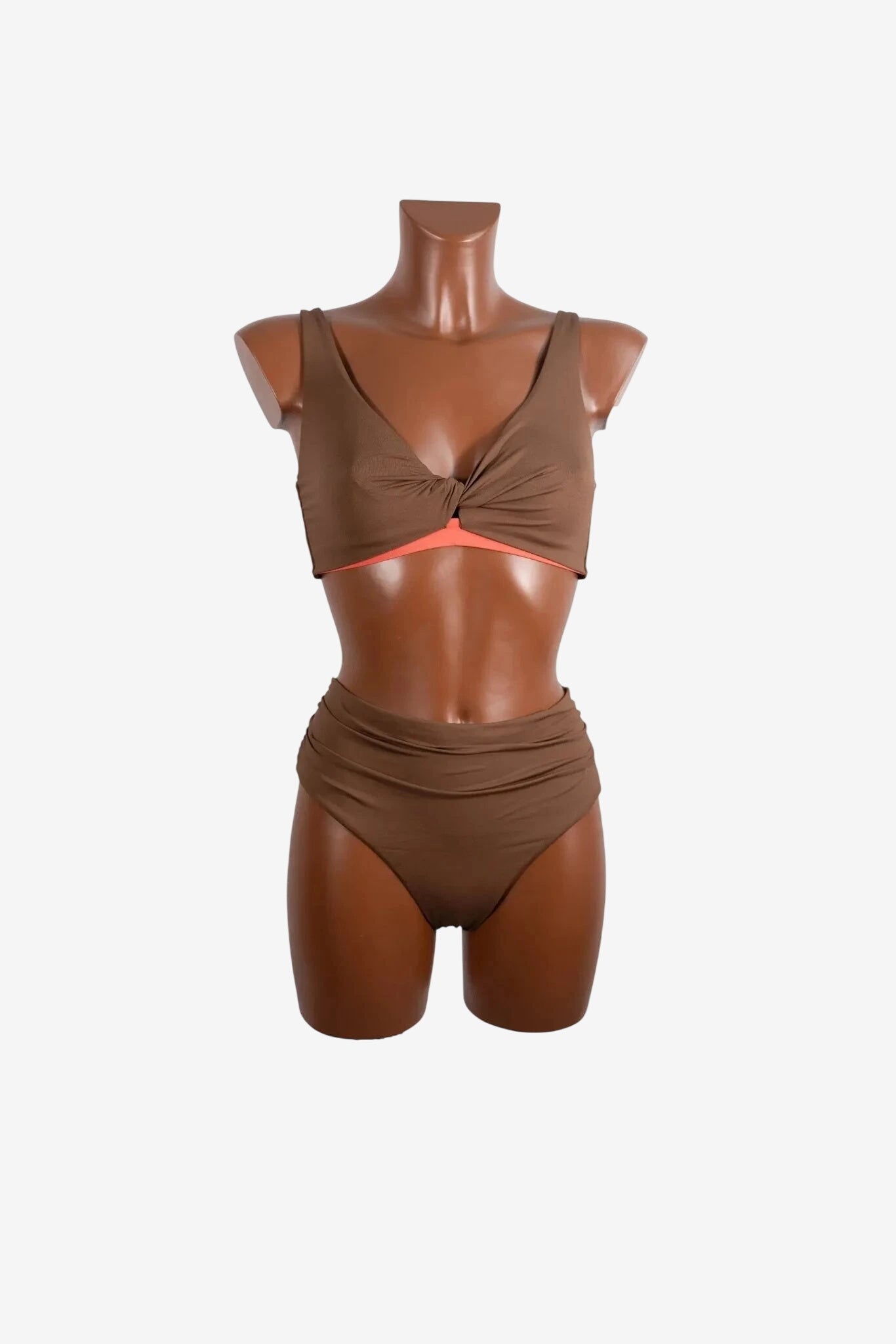 A brown two-piece bikini with a twisted front top and high-waisted bottoms on a mannequin.