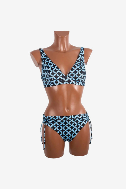 A black and light blue geometric print bikini set with a v-neck top and side-tie bottoms.