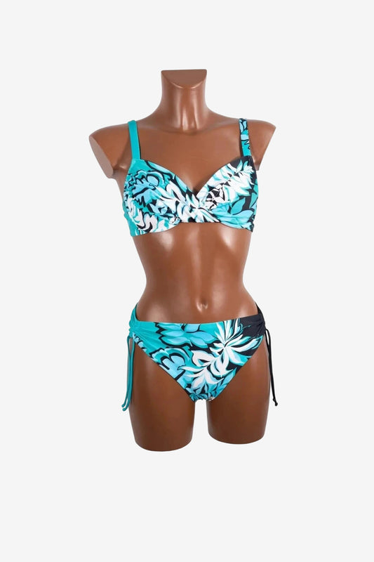 A turquoise and black floral print bikini with a twisted underwire top and side-tie bottoms.