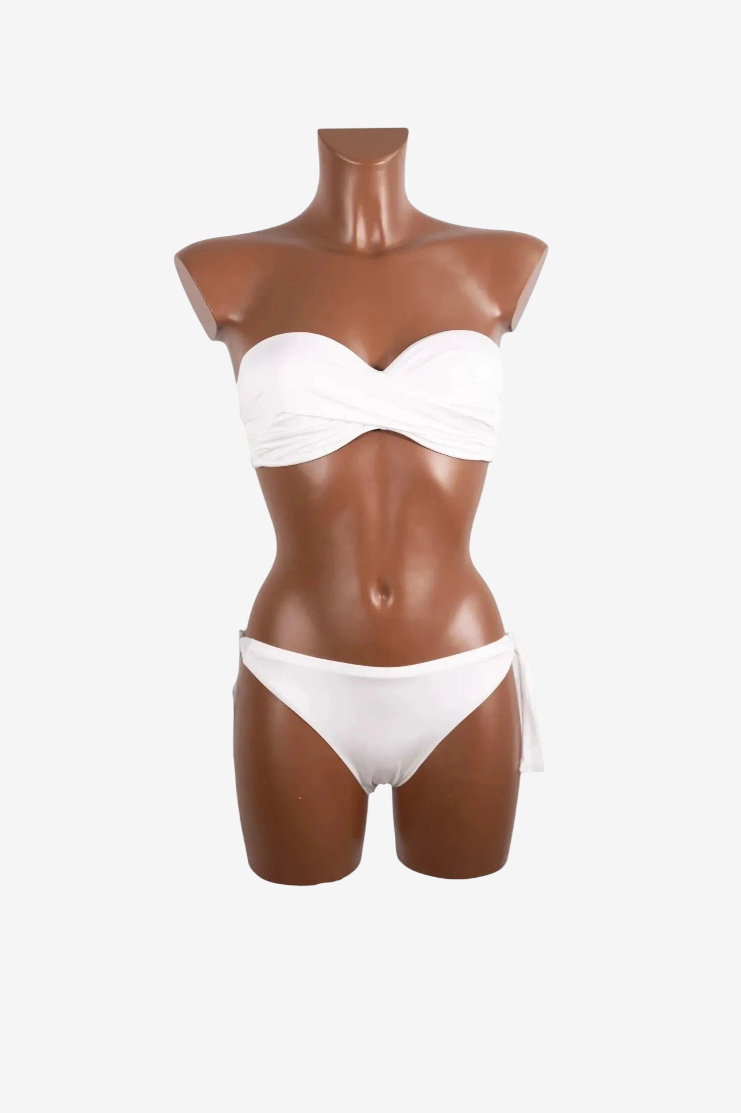 A white strapless balconette bikini set displayed on a brown mannequin.