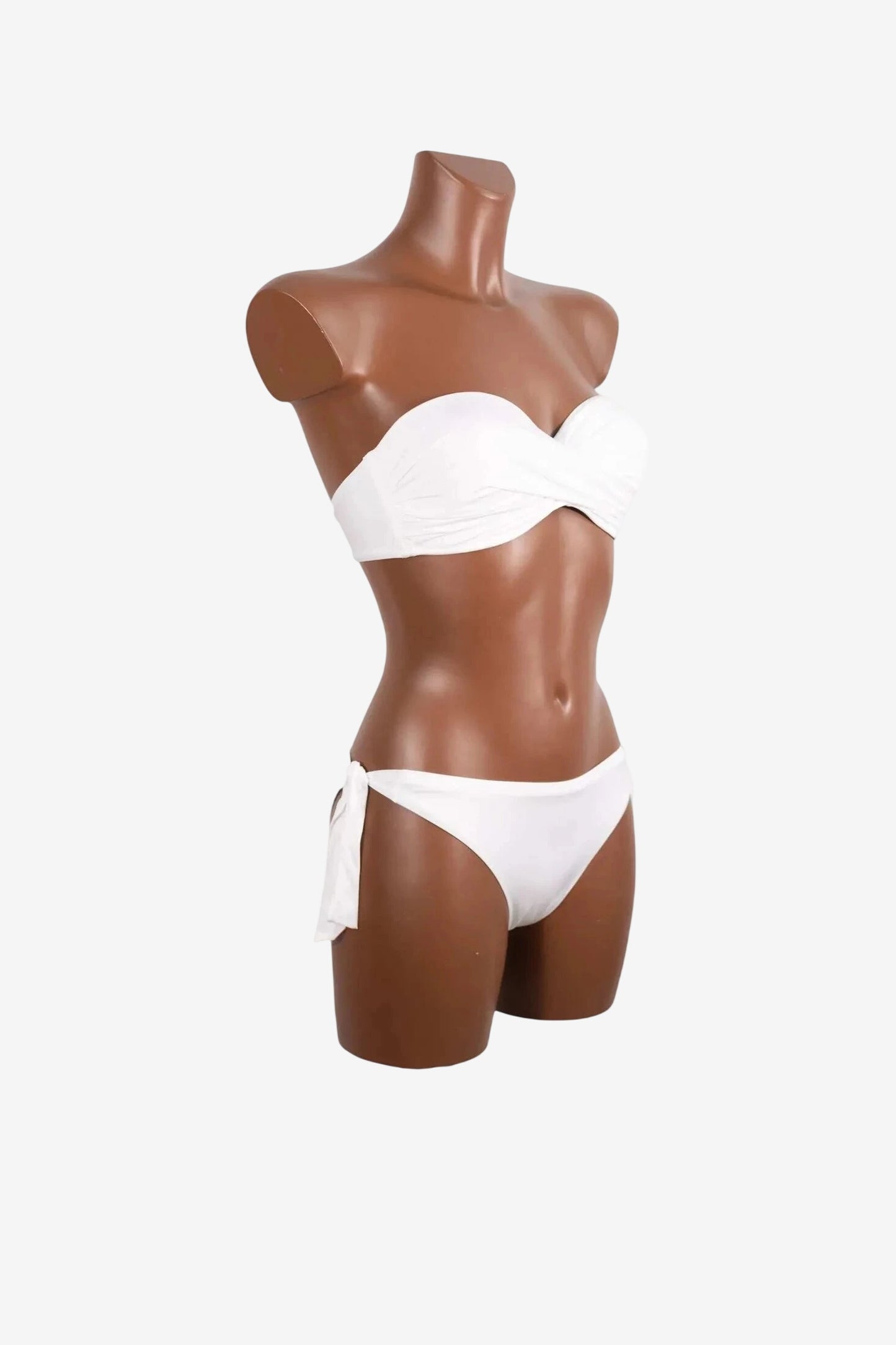 A white strapless balconette bikini set displayed on a brown mannequin.