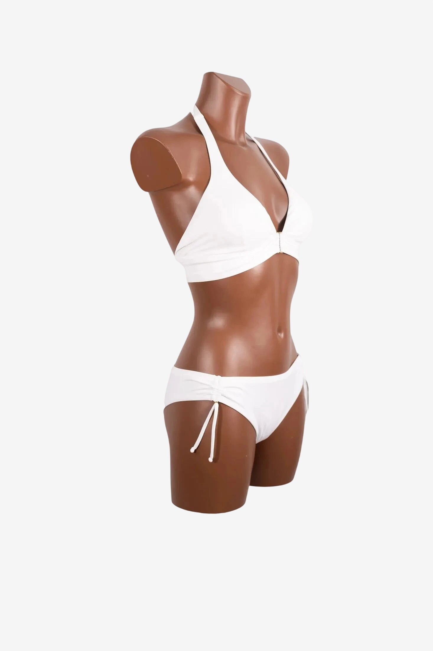 Bikini a triangolo bianco Roidal con allacciatura al collo e slip con fiocchetti laterali.