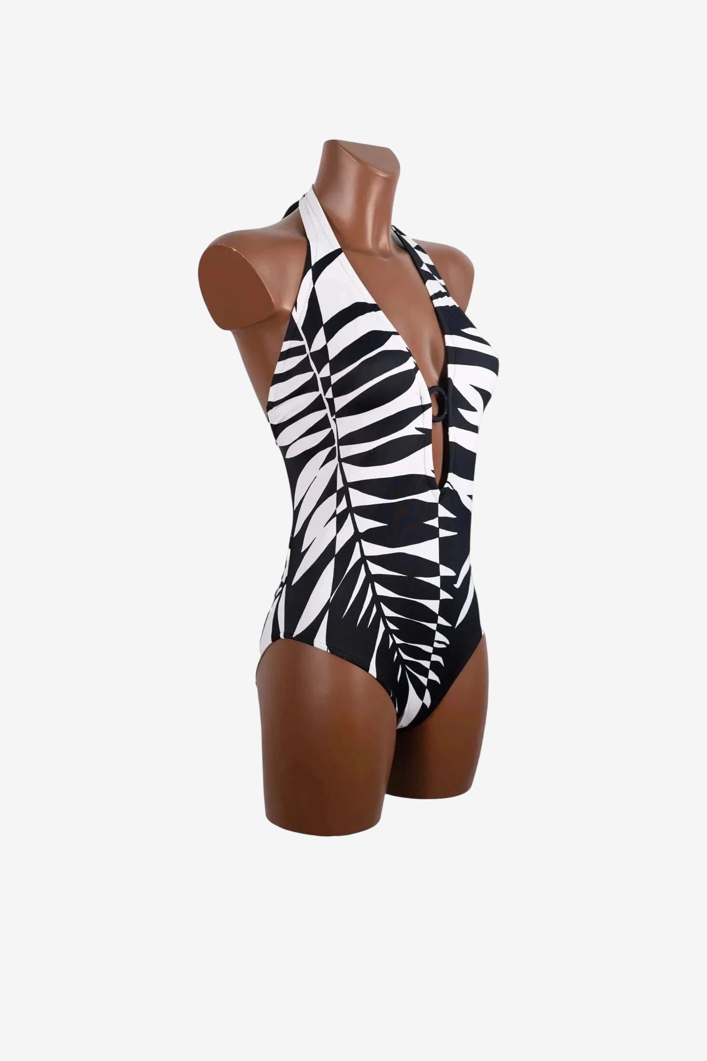 Costume intero Roidal con scollo all'americana e stampa a foglie bianche e nere.