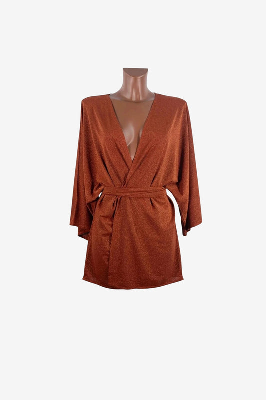 A copper-colored, glittery kimono-style mini dress with a deep V-neck and a tie waist.