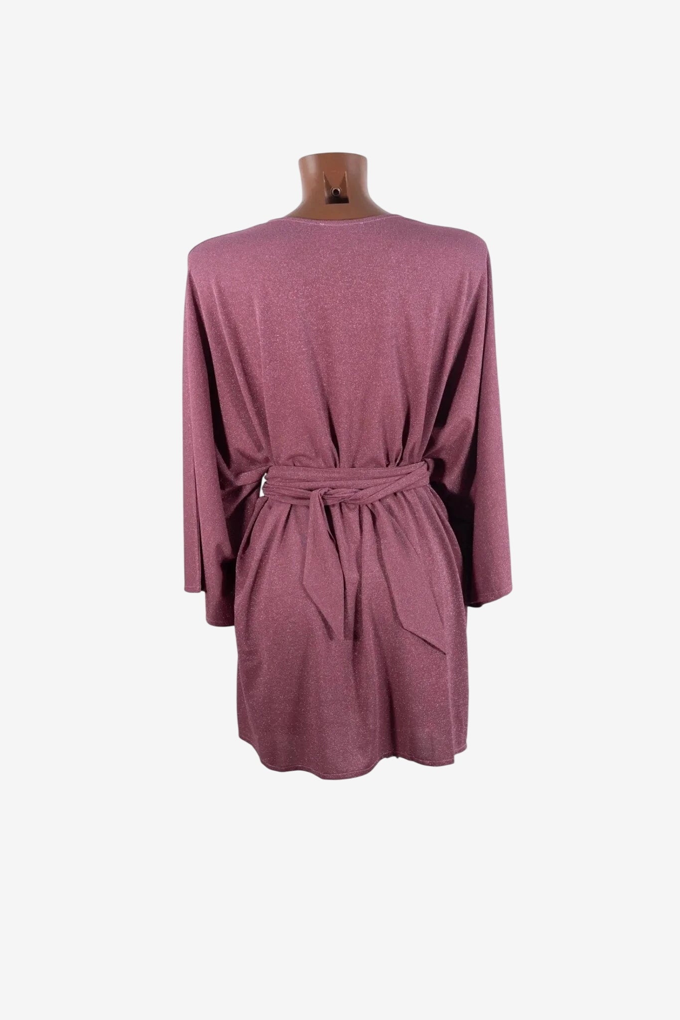 A mauve, shimmering kimono with wide sleeves and a matching tie-waist belt.
