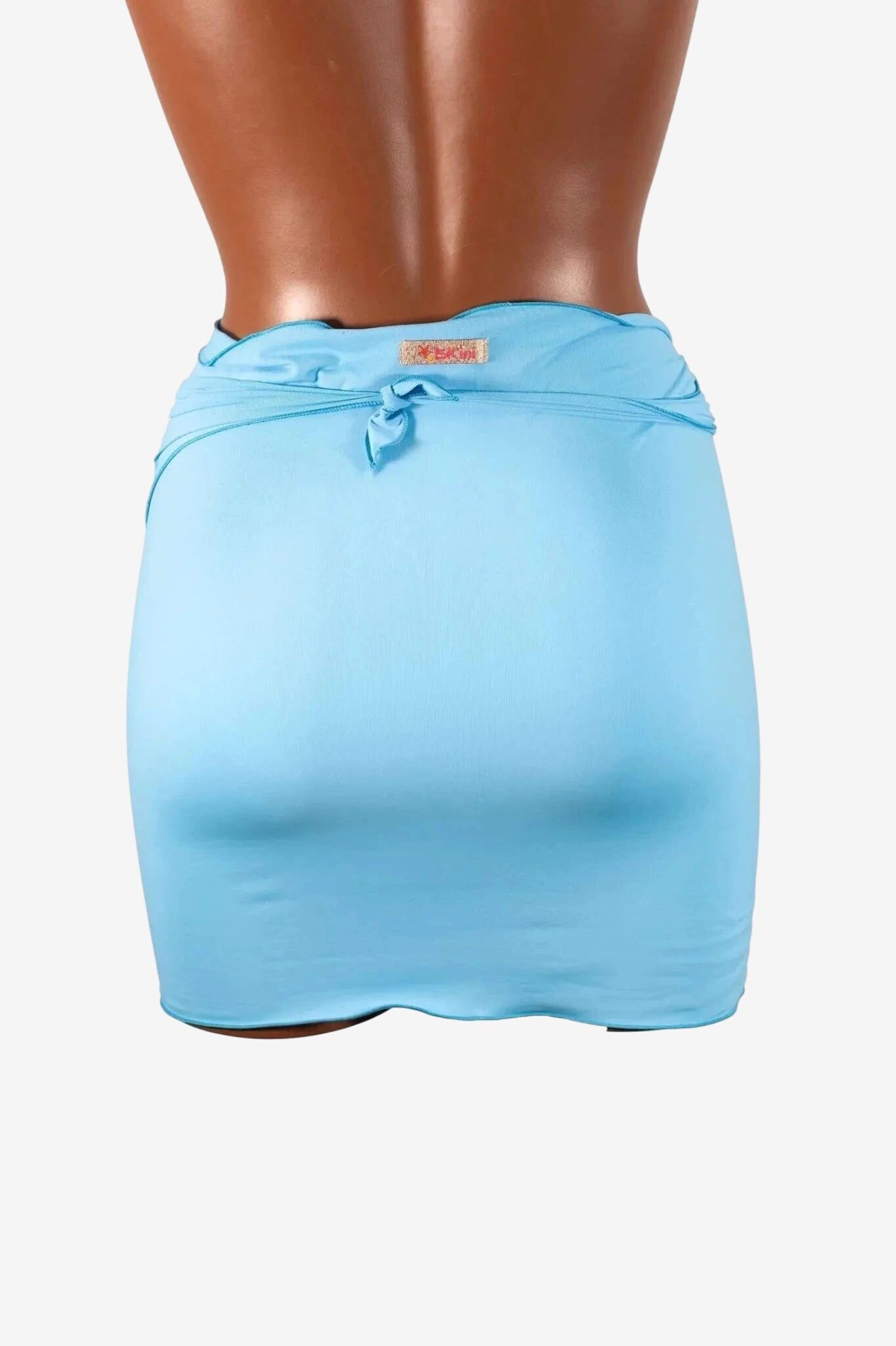 A light blue mini pareo in lycra with a tie-waist detail shown on a mannequin.