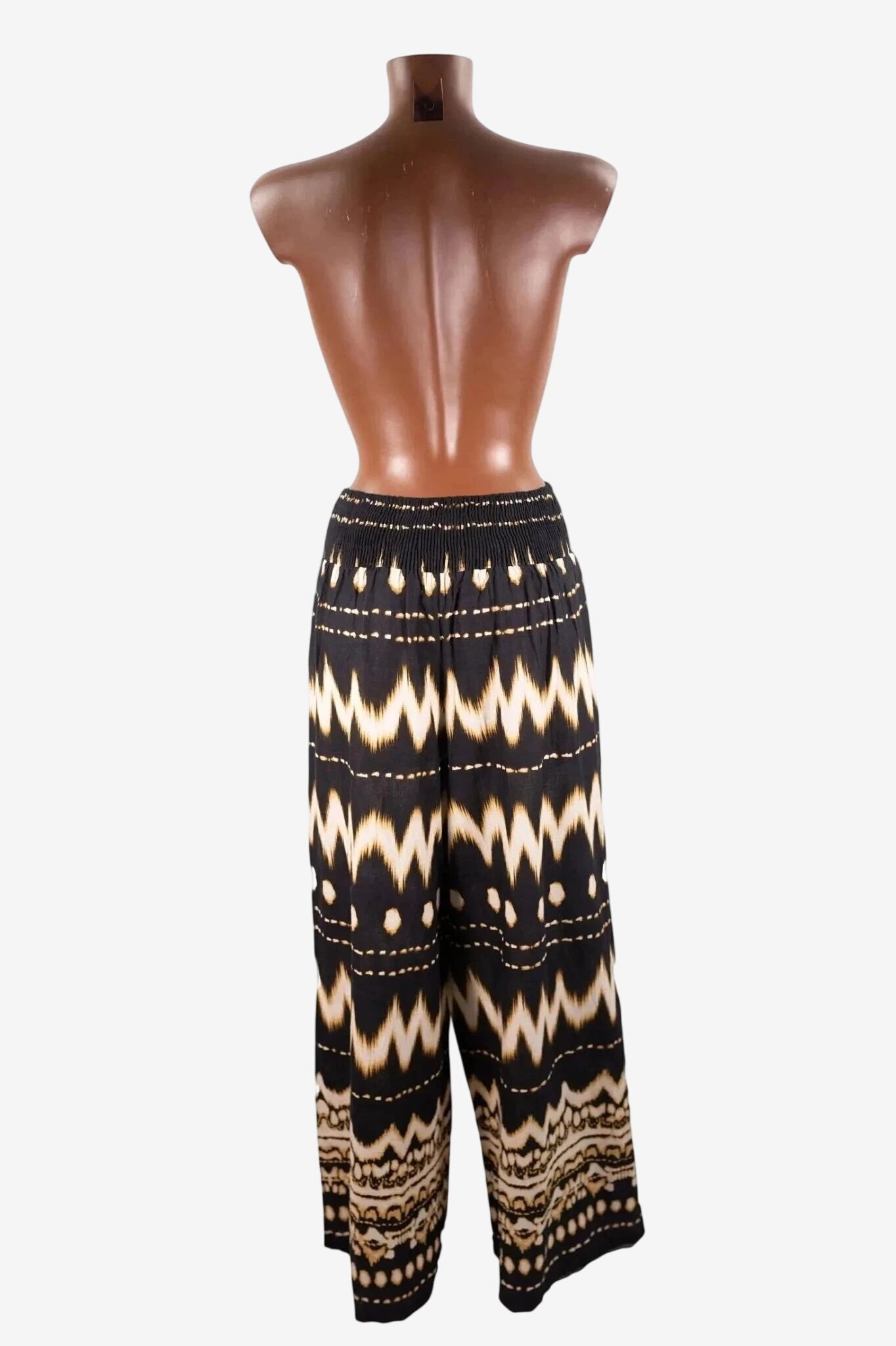Pantapalazzo nero con fantasia geometrica a zig zag e vita elasticizzata.