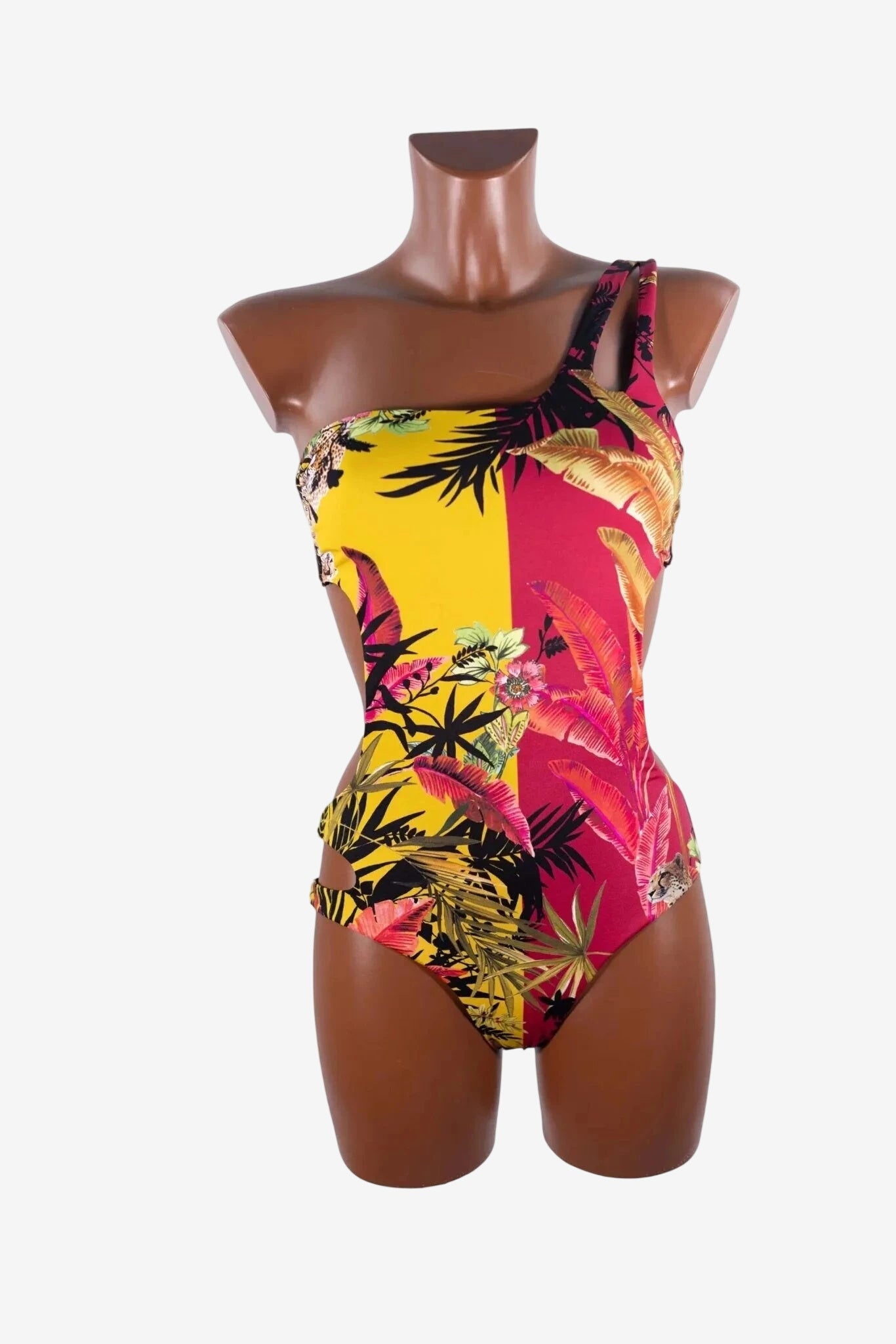 Costume intero Miss Bikini asimmetrico con stampa tropicale gialla e rossa.