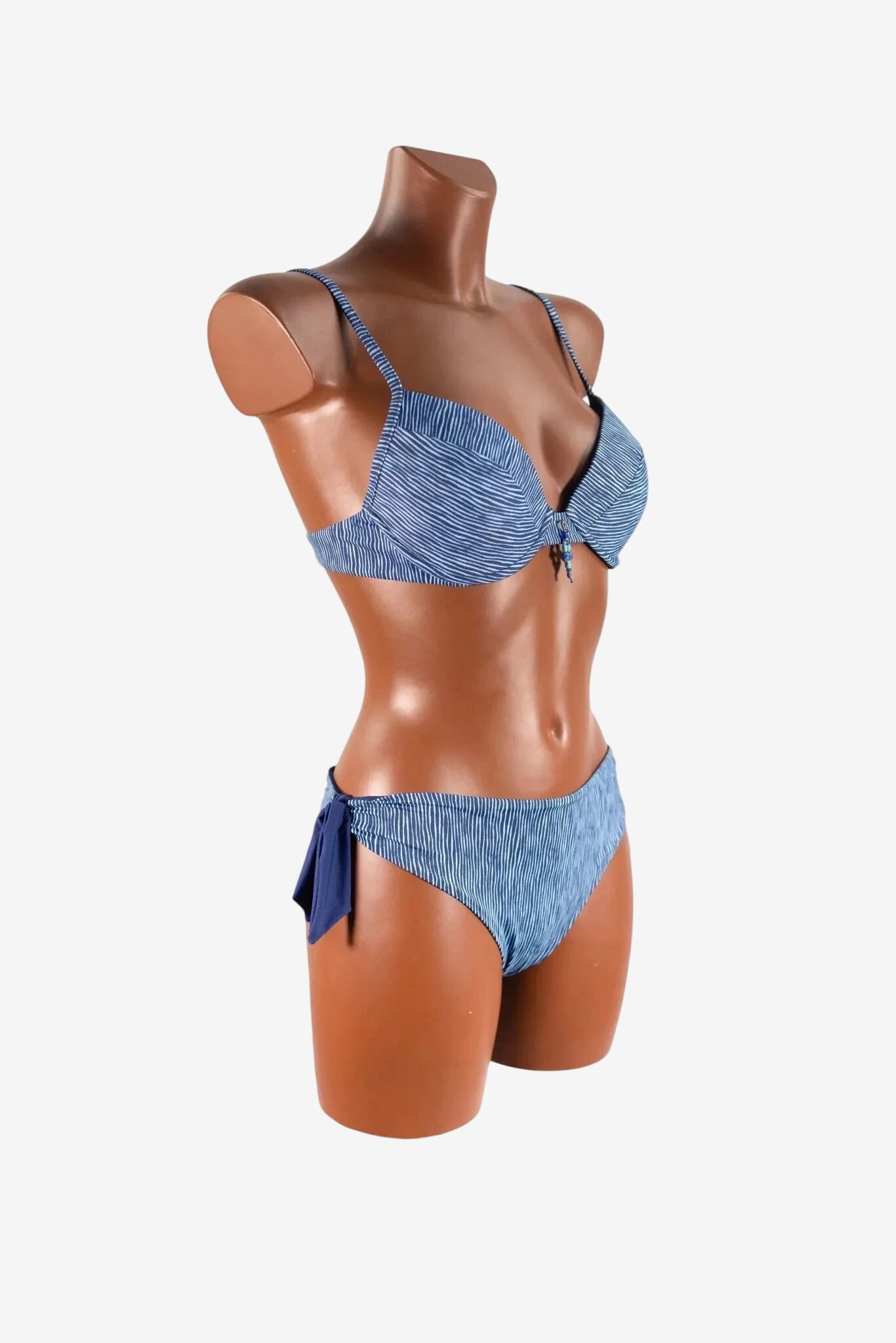 A blue and white striped bikini set with a bow detail on the side of the bottoms.