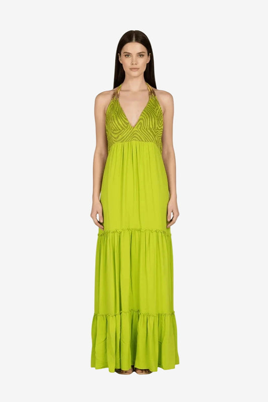 Abito lungo color lime con busto a triangolo in lurex, lacci al collo e gonna a balze.