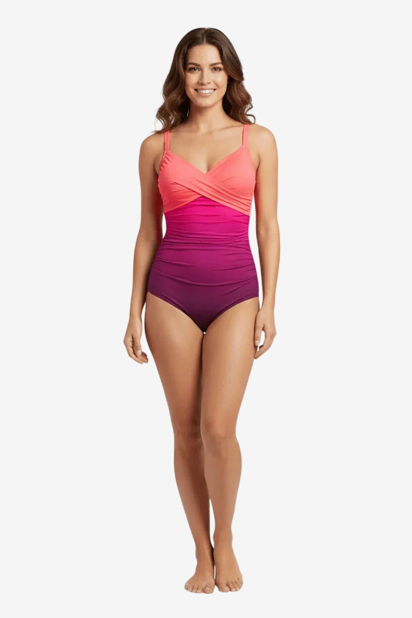 Costume intero Roidal con ferretto, caratterizzato da una sfumatura corallo e drappeggi modellanti.