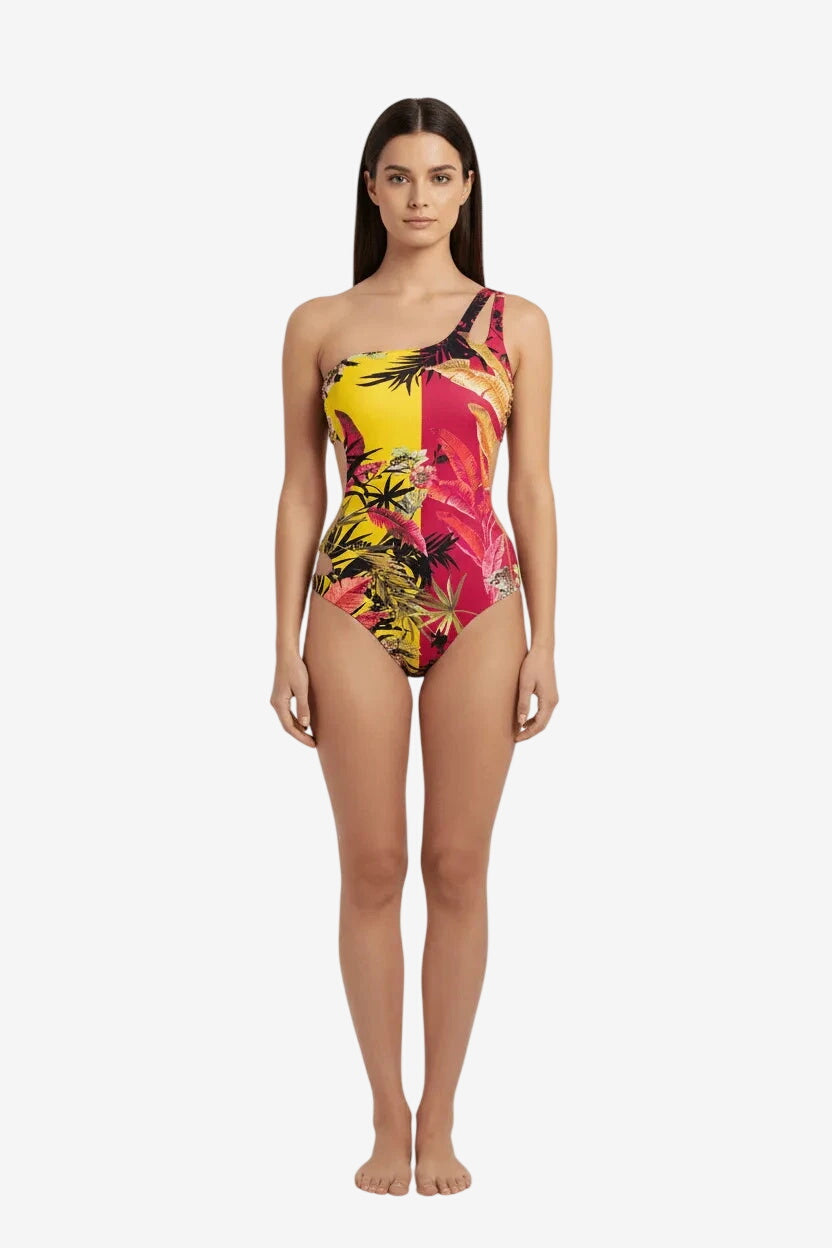 Costume intero Miss Bikini asimmetrico con stampa tropicale gialla e fucsia.