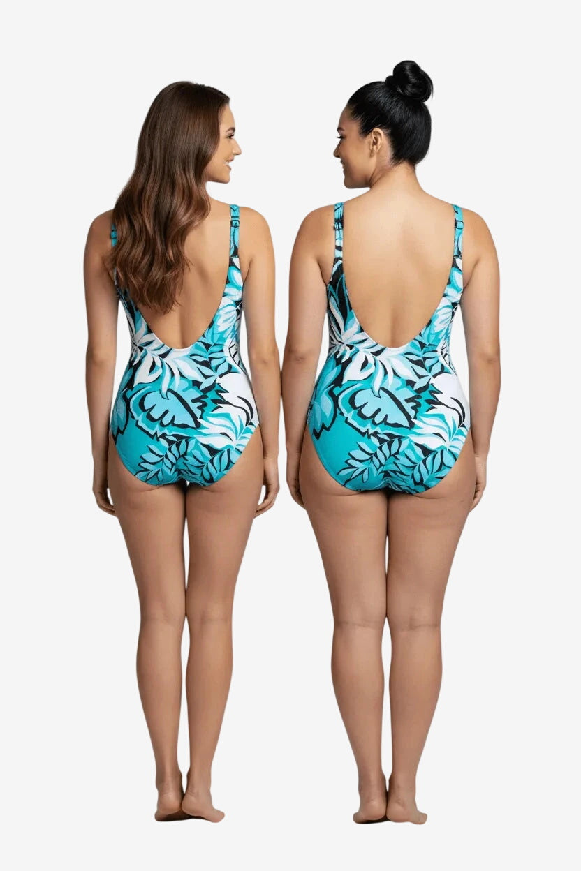 Due modelle indossano un costume intero Roidal con stampa floreale turchese, bianca e nera.
