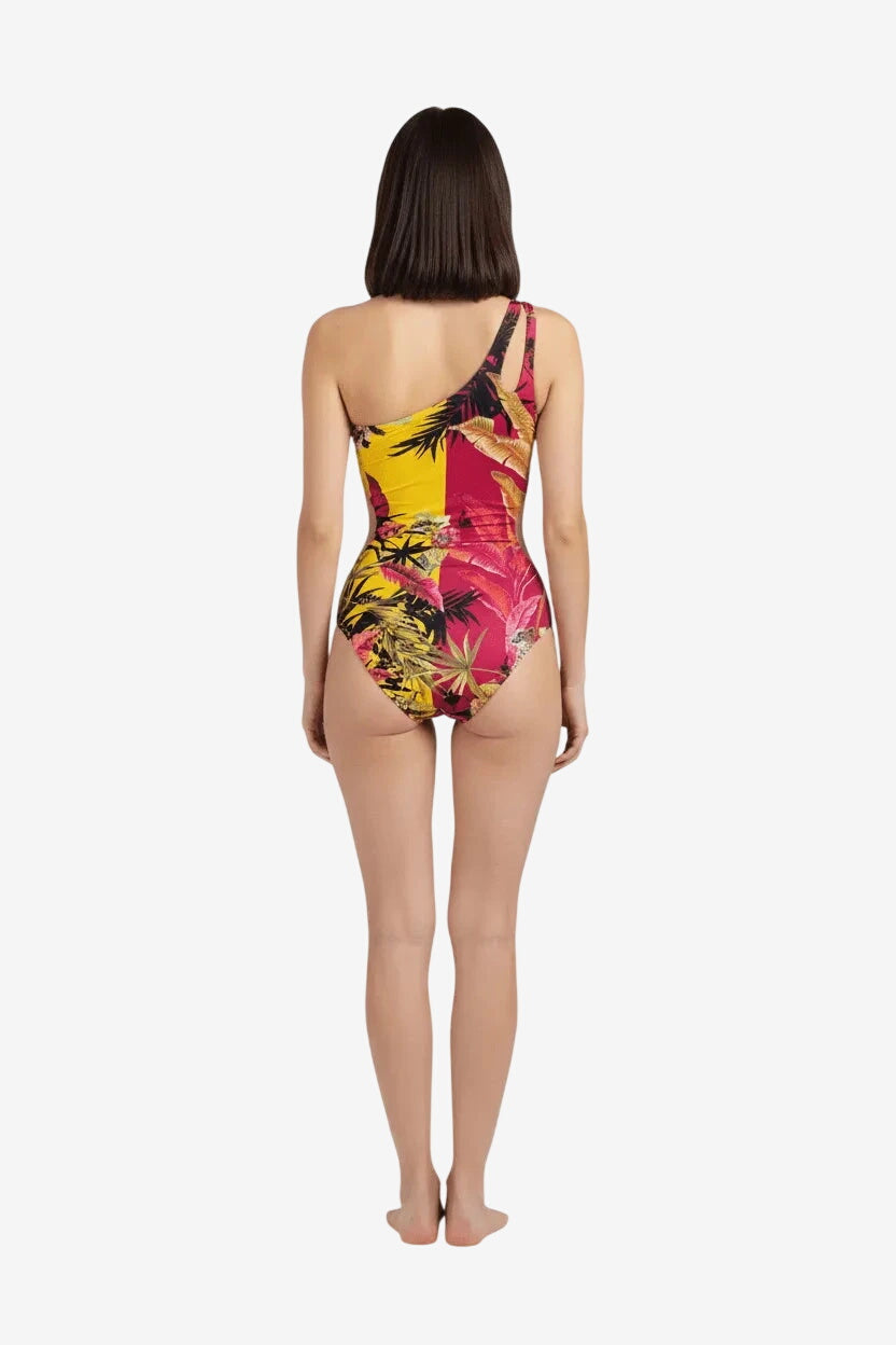 Costume intero Miss Bikini asimmetrico con stampa tropicale bicolore gialla e fucsia.