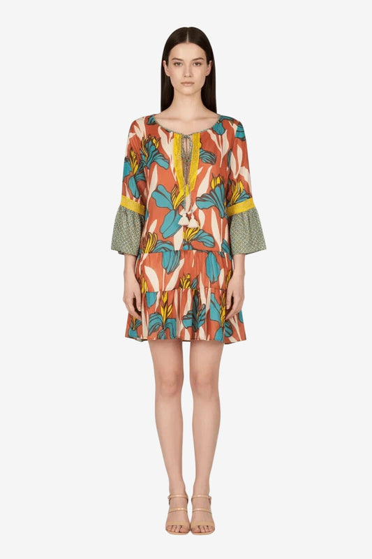 Kaftano corto in cotone con stampa floreale, maniche a campana e dettagli in pizzo.