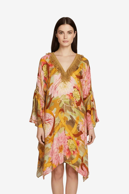 Short yellow viscose kaftan with a floral print, wide sleeves, and gold fringe trim at the neckline.