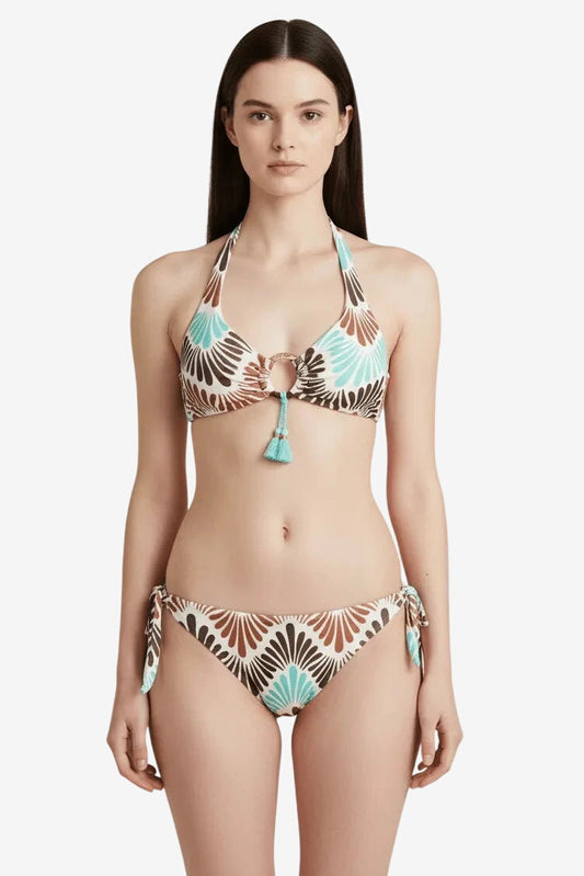 A woman wears a two-piece bikini featuring a brown and turquoise fan-shaped print.
